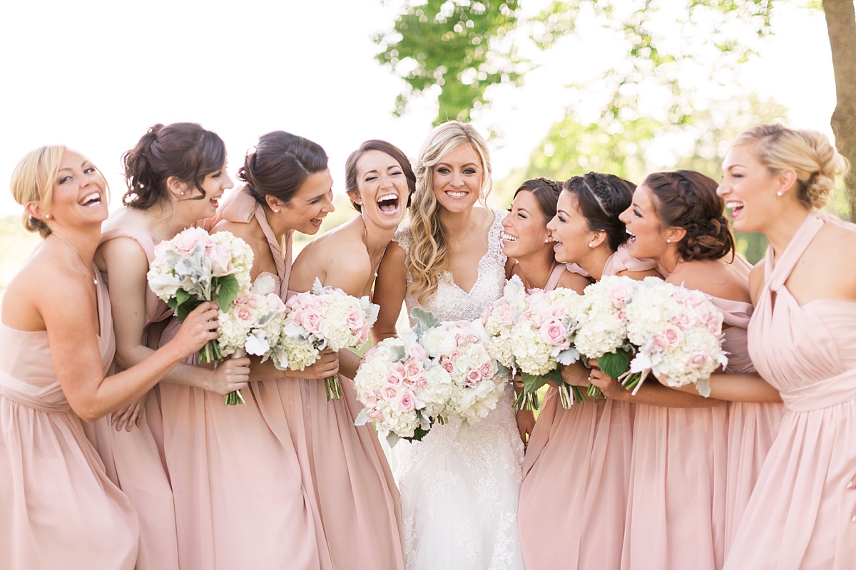 A stunning wedding at Bull Run Golf Club in Haymarket, VA featuring a dreamy pink and cream color palette and overflowing with gorgeous florals.