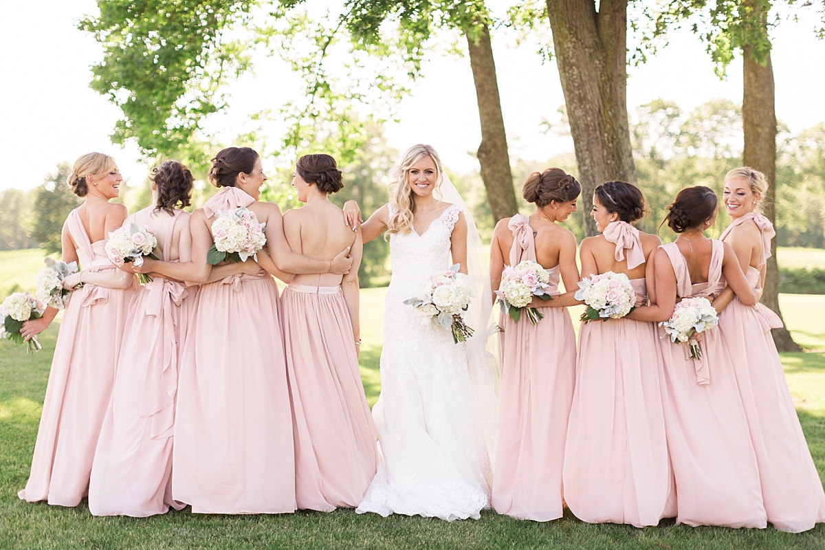 A stunning wedding at Bull Run Golf Club in Haymarket, VA featuring a dreamy pink and cream color palette and overflowing with gorgeous florals.