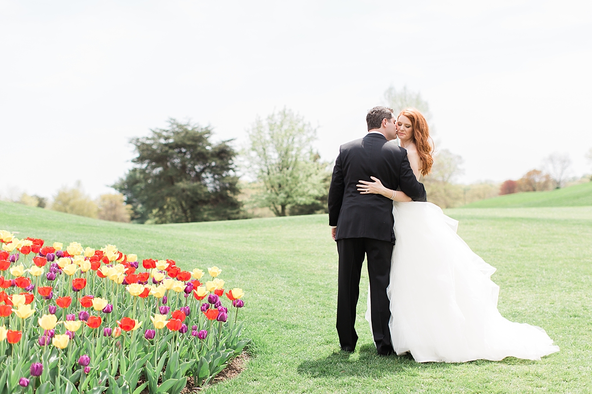 A classic brunch wedding at the Springfield Golf and Country Club outside of Washington, DC featuring fun Jewish traditions and beautiful spring tulips.