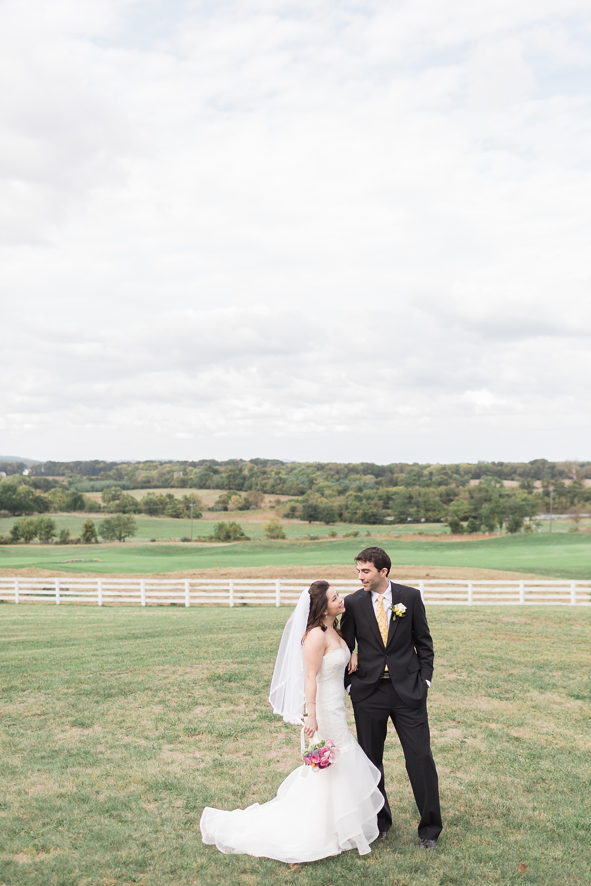 A romantic wedding at Raspberry Plain in Leesburg, VA with unique details including an altar made out of 1000 colorful paper cranes. 
