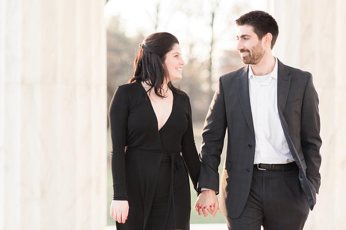 A Washington, DC wedding photographer heads downtown to the classic Library of Congress and DC War Memorial for a winter engagement session filled with sun. 