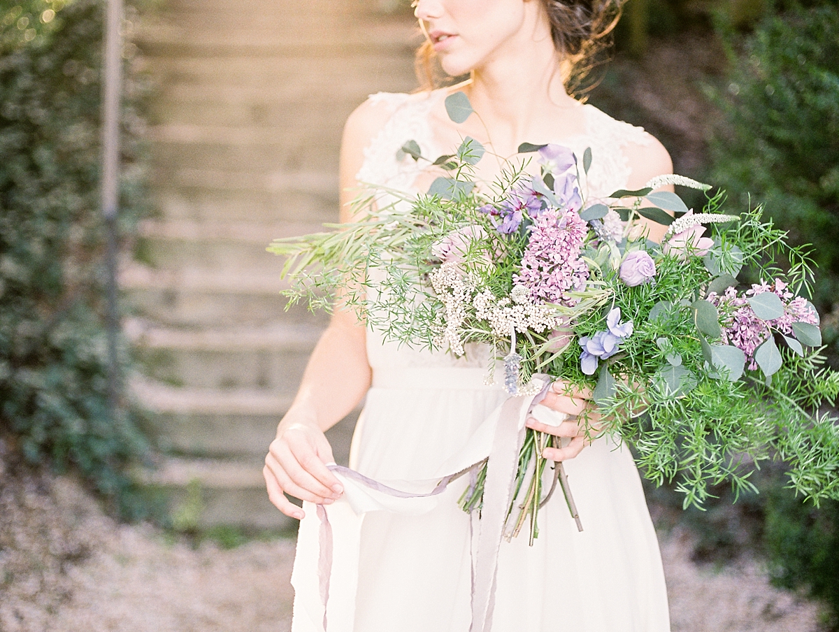 A stunning French Provencal wedding photographed by a Washington, DC wedding photographer in the hedged gardens at Oatlands Plantation in Leesburg, VA.