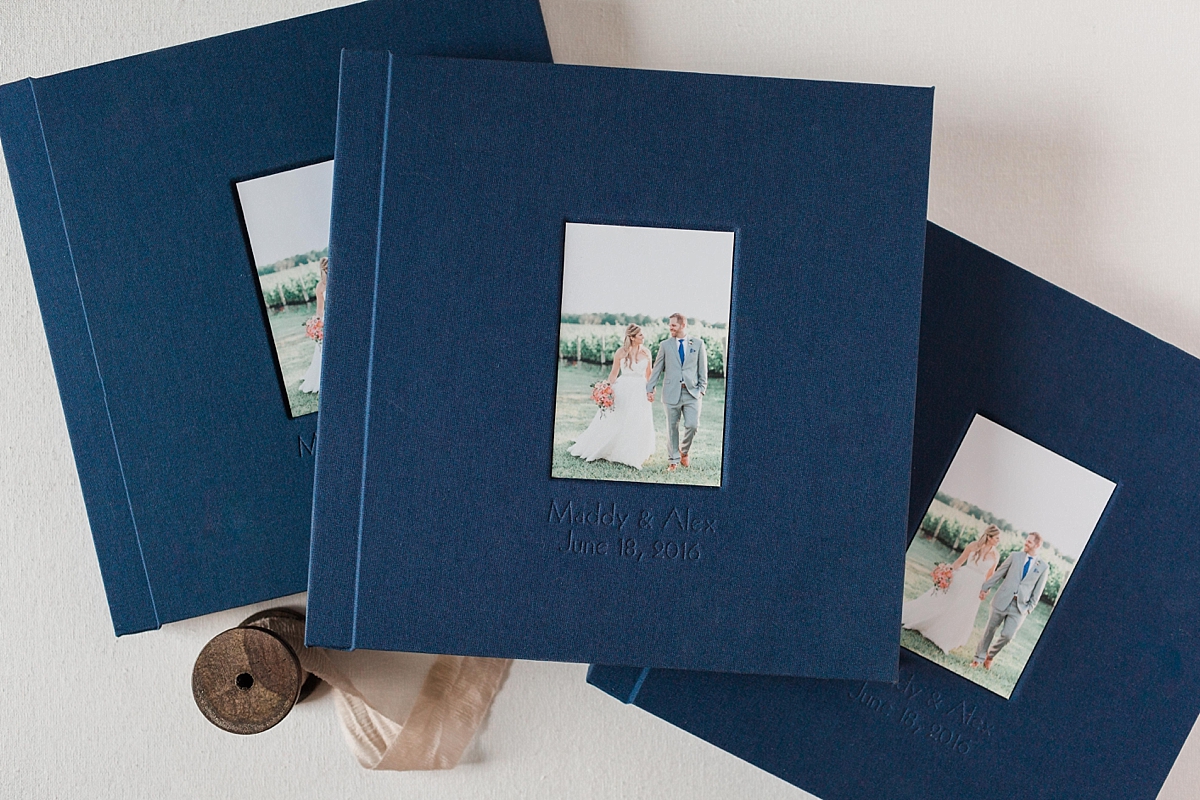 A gorgeous navy linen wedding album of images photographed by Washington, DC photographer Alicia Lacey at Stone Tower Winery in Leesburg, VA.