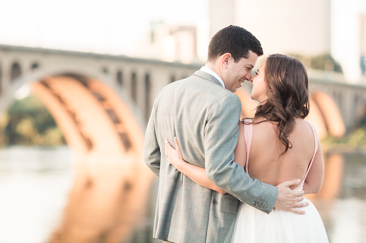 A stylish couple enjoys a sunrise engagement session along the iconic canals of Georgetown in Washington, DC; complete with a tulle skirt and Louboutin heels.