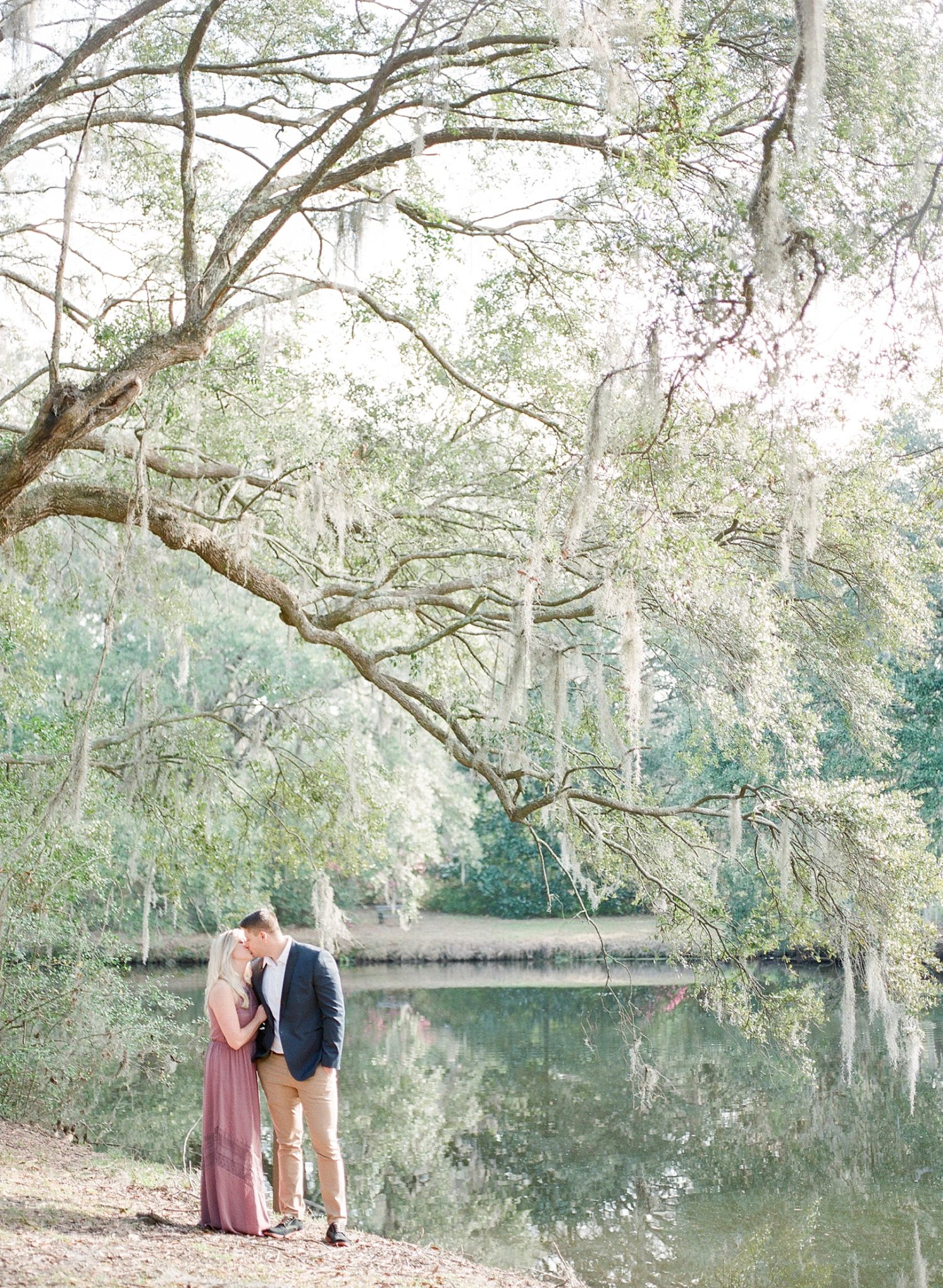 A romantic anniversary session is photographed at the historic wedding venue of Legare Waring House in Charleston, SC