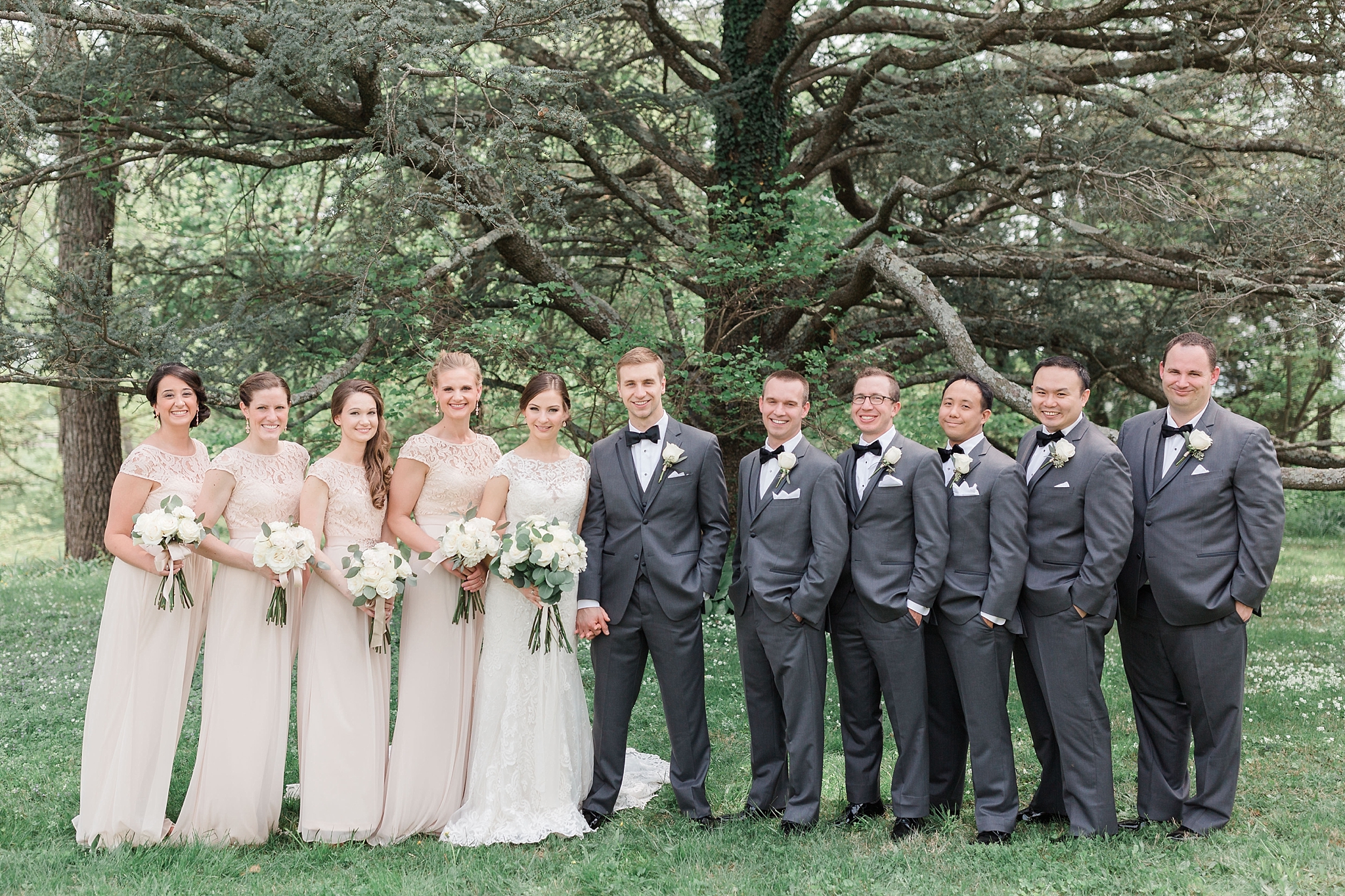 A fun spring wedding at Stonewall Golf Club in Gainesville, VA with portraits at Oatlands Historic House in Leesburg, VA. 