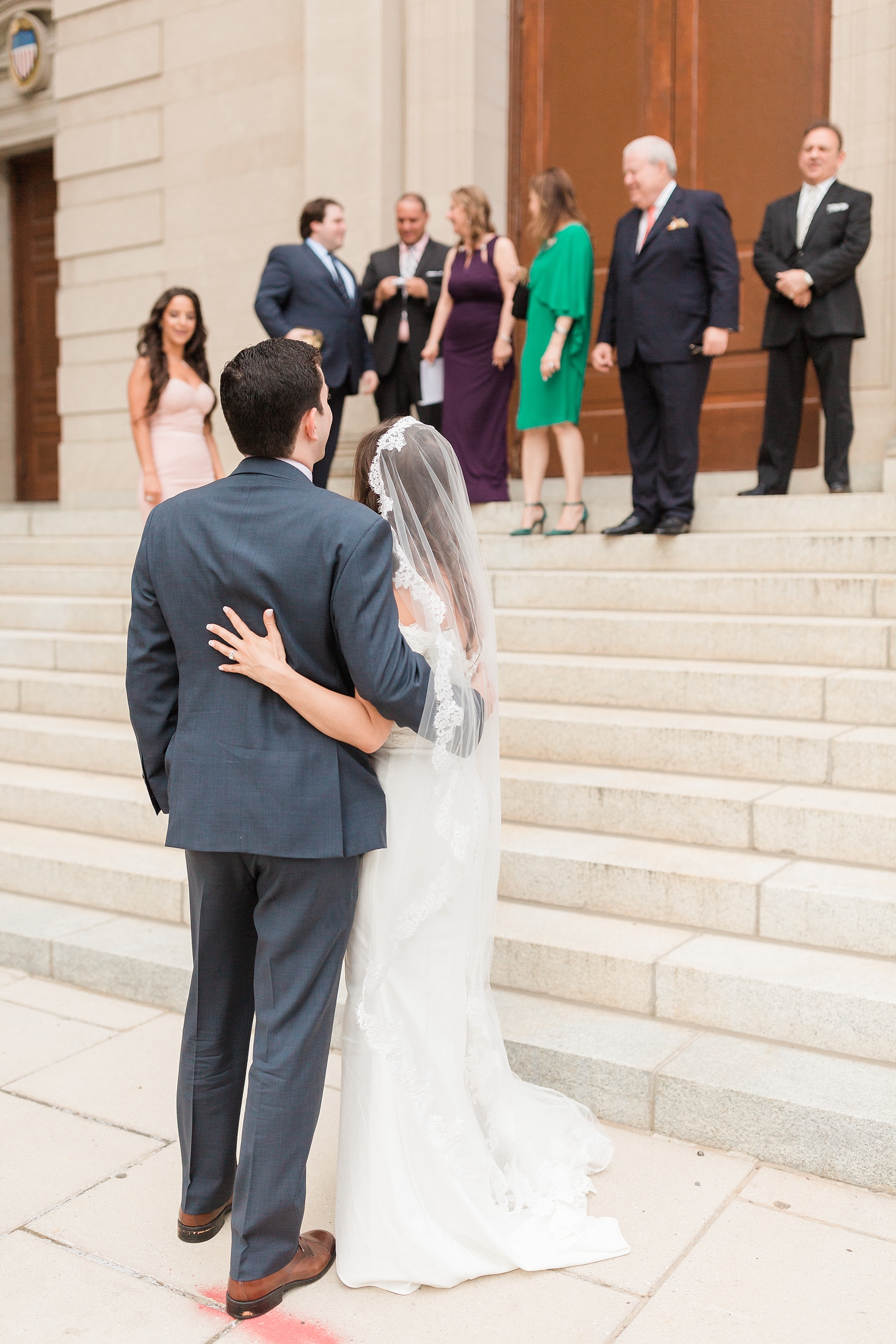 A traditional Catholic wedding ceremony is held in Washington, DC with stunning couple's portraits at the iconic Jefferson Memorial. 