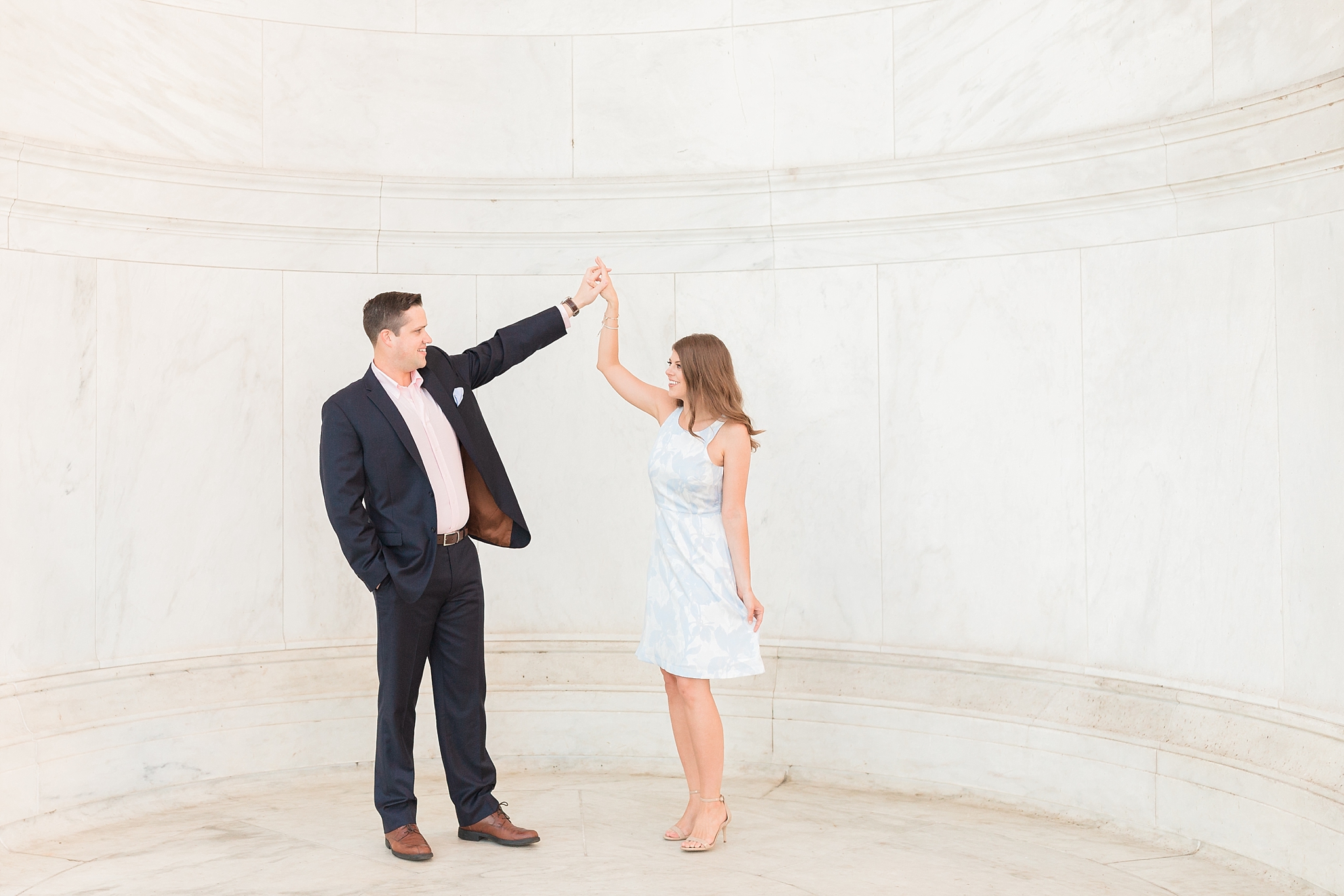 A summer sunrise engagement session is photographed by DC wedding photographer, Alicia Lacey, at the iconic Jefferson Memorial.