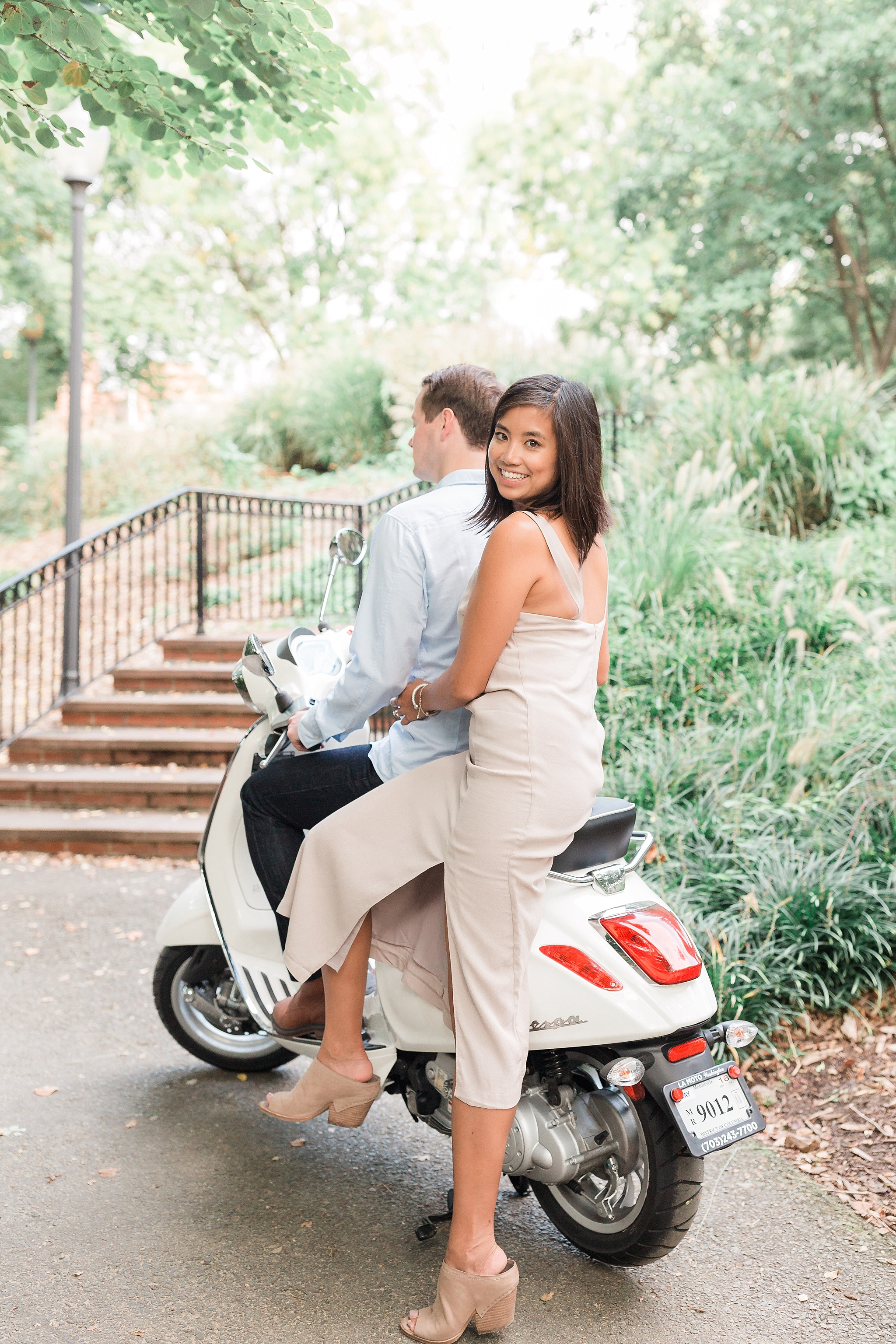A romantic sunrise engagement session in the Georgetown area of Washington, DC features the stylish couple's Vespa.
