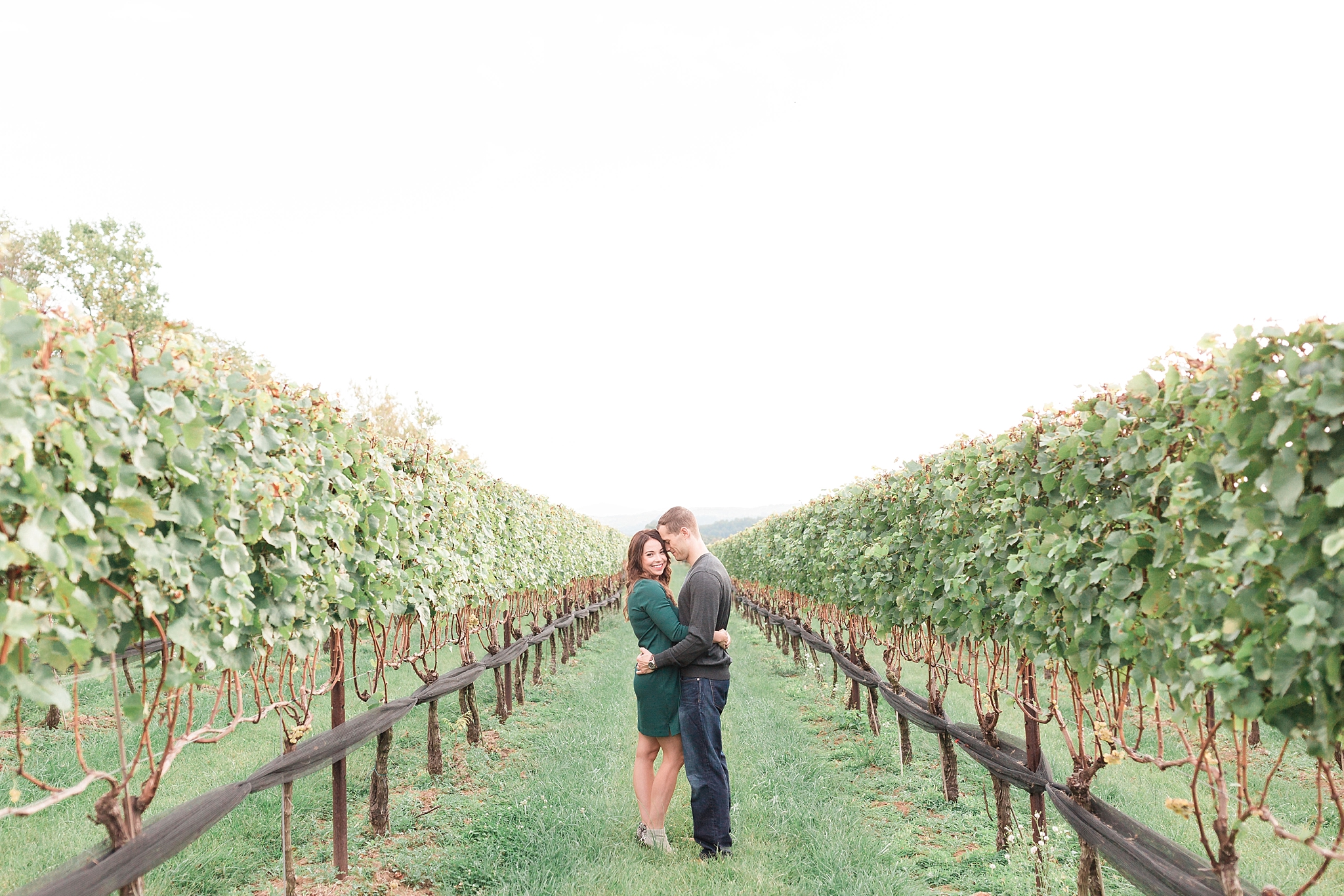 A romantic fall engagement photo session at Stone Tower Winery, a popular vineyard in Leesburg, VA.