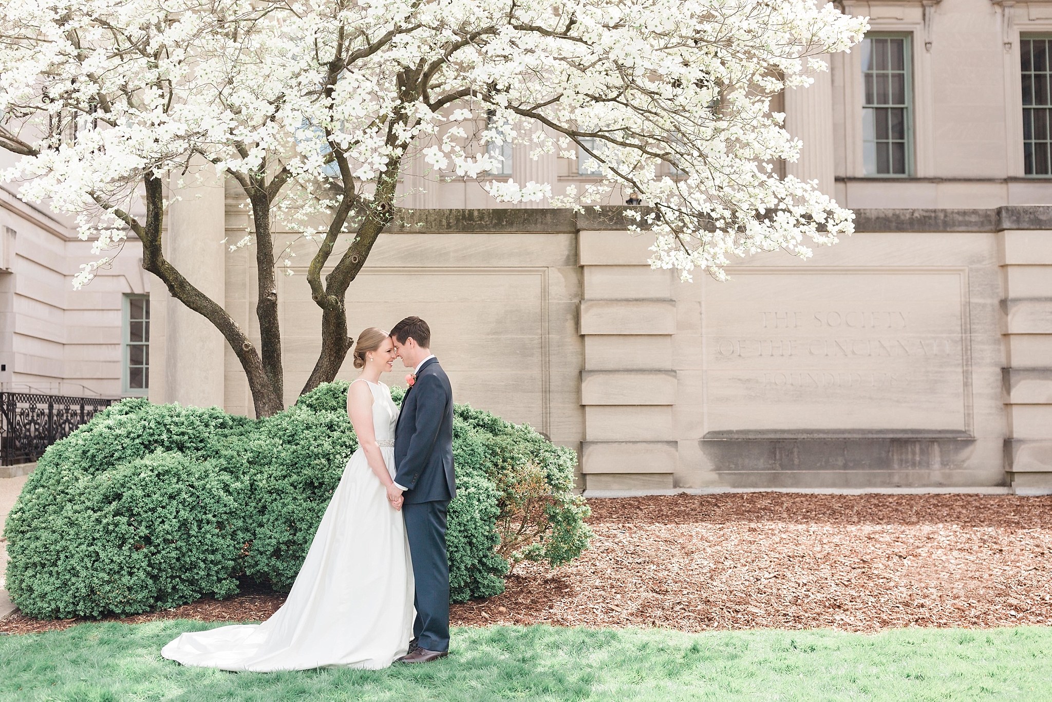 This classic DC wedding is held at the Society of the Cincinnati and Whittemore House in NW Washington, DC with a refreshing spring color palette of blush, peach, and navy blue. 