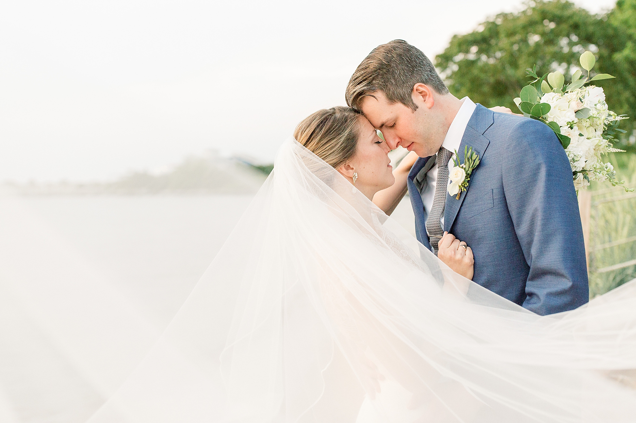 An elegant coastal wedding photographed by Alicia Lacey Photography at the Chesapeake Bay Beach Club in Stevensville, MD.
