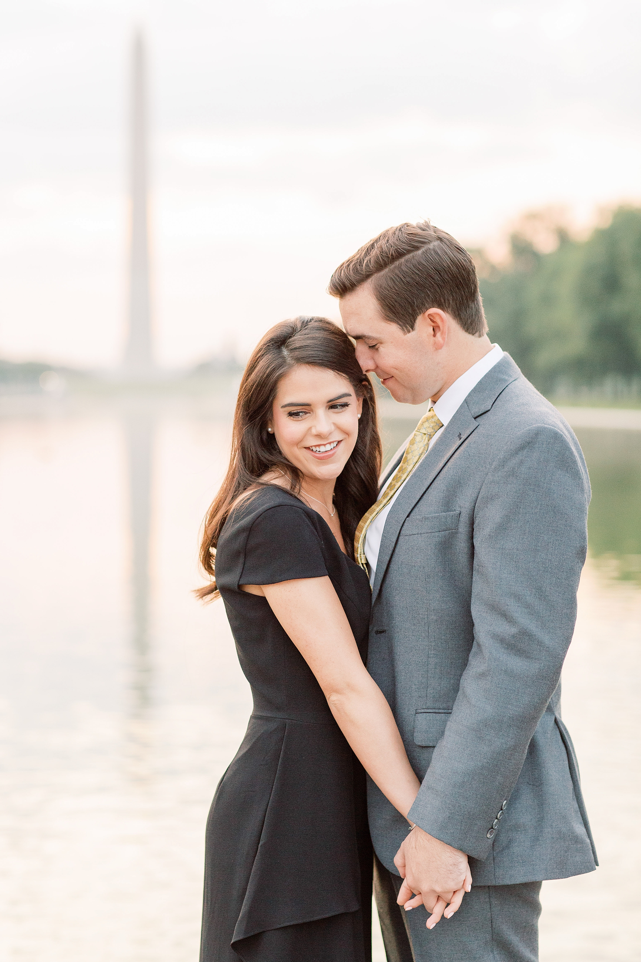 A stunning sunrise engagement session in Washington, DC at locations including the Lincoln Memorial, Constitution Gardens, and DC War Memorial.