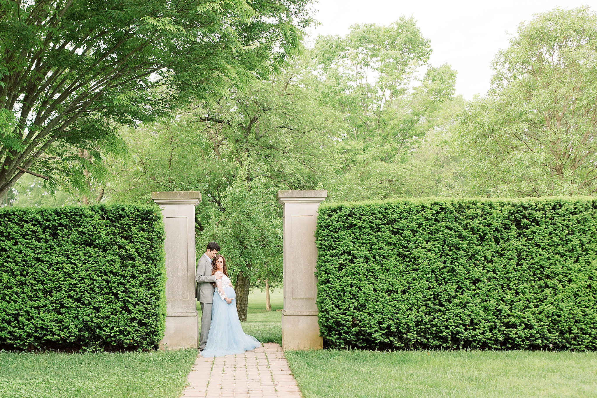 A stylish maternity session with a delicate lace and blue tulle gown at Great Marsh Estate in Bealeton, VA.