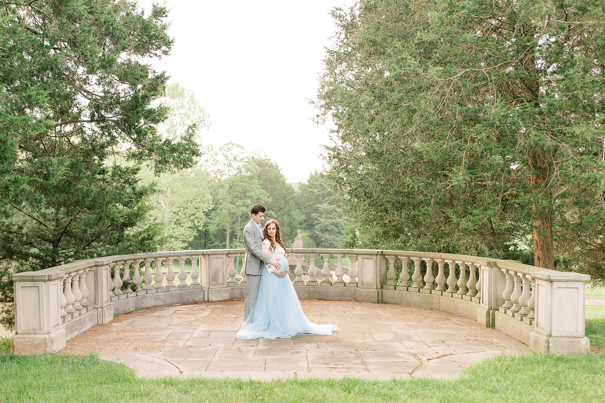 A stylish maternity session with a delicate lace and blue tulle gown at Great Marsh Estate in Bealeton, VA. 