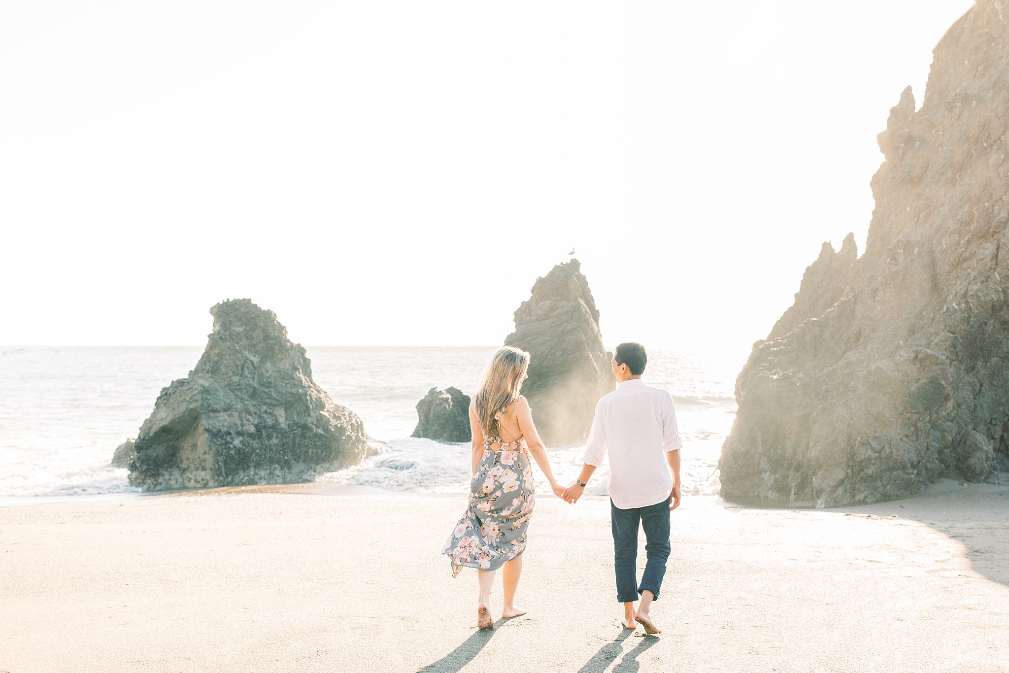 A romantic sunset engagement session at Rodeo Beach in Marin Headlands and Sutro Baths outside of San Francisco, CA.