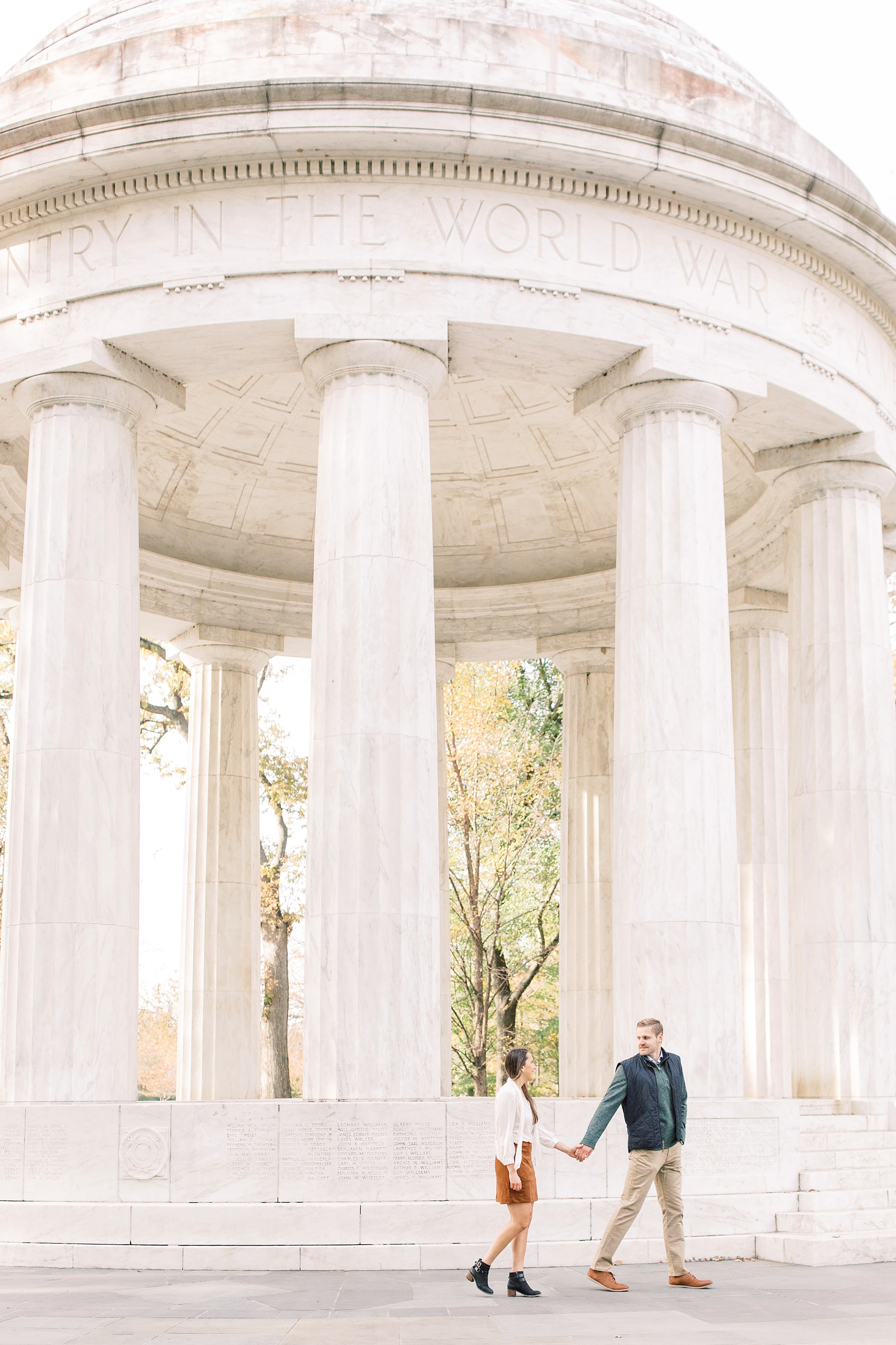A romantic set of fall engagement photos taken at iconic DC monuments including the Lincoln Memorial and the DC War Memorial.