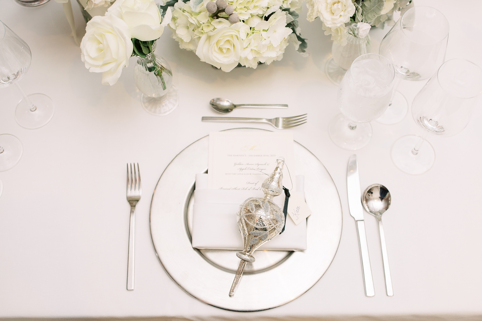 An elegant December wedding at the Fairmont Hotel in Washington, DC designed by EVOKE with florals by Amaryllis. 