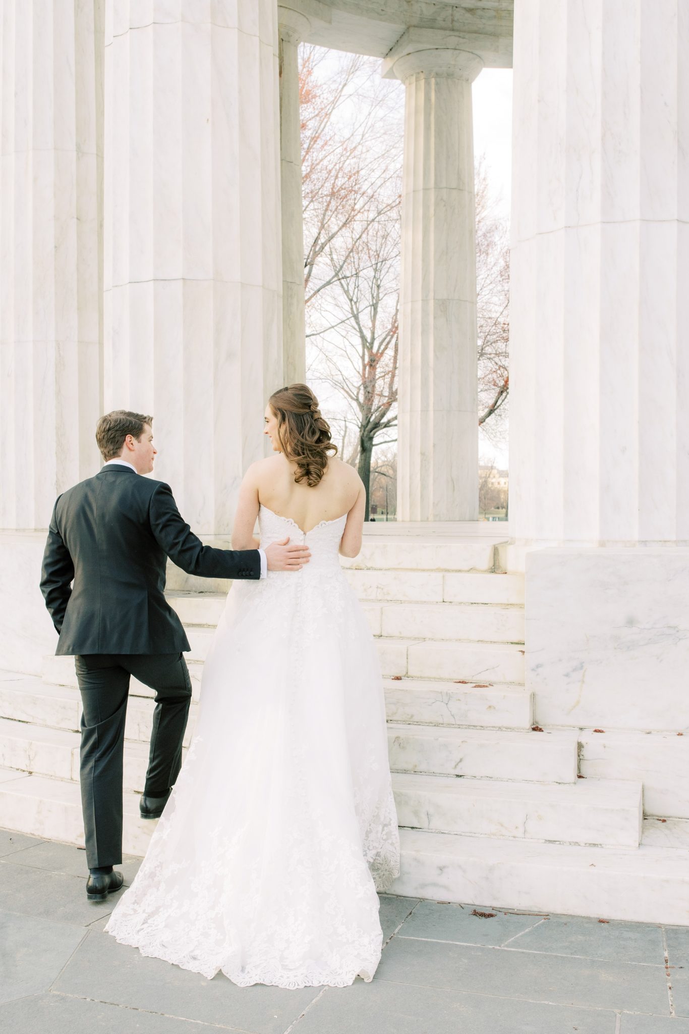 A romantic winter wedding across Washington, DC including St Matthews Cathedral, the DC War Memorial, and the National Museum of Women in the Arts.