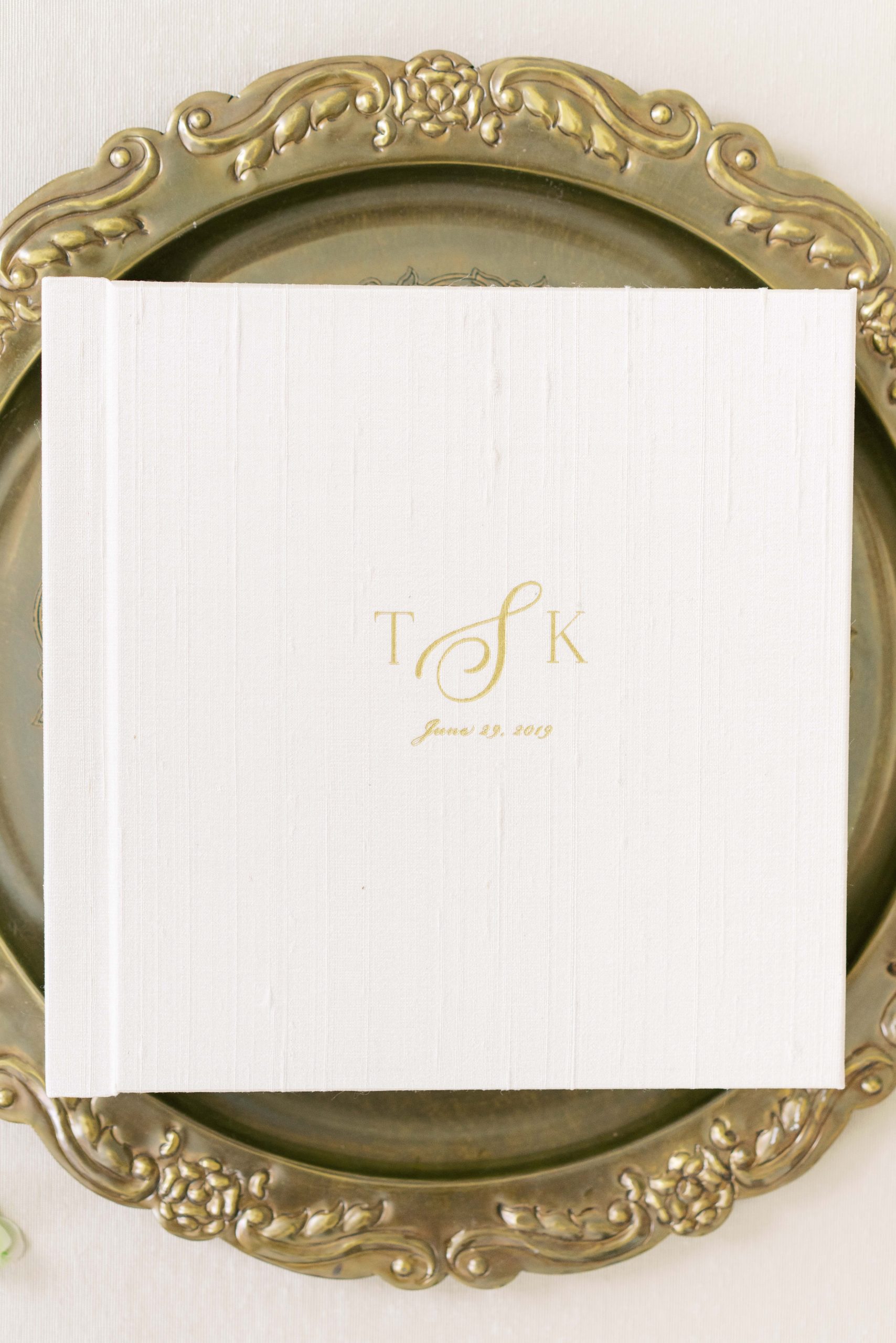 A stunning cream silk heirloom album featuring images from a Meridian House wedding in Washington, DC; complete with a custom foil monogram embossing.