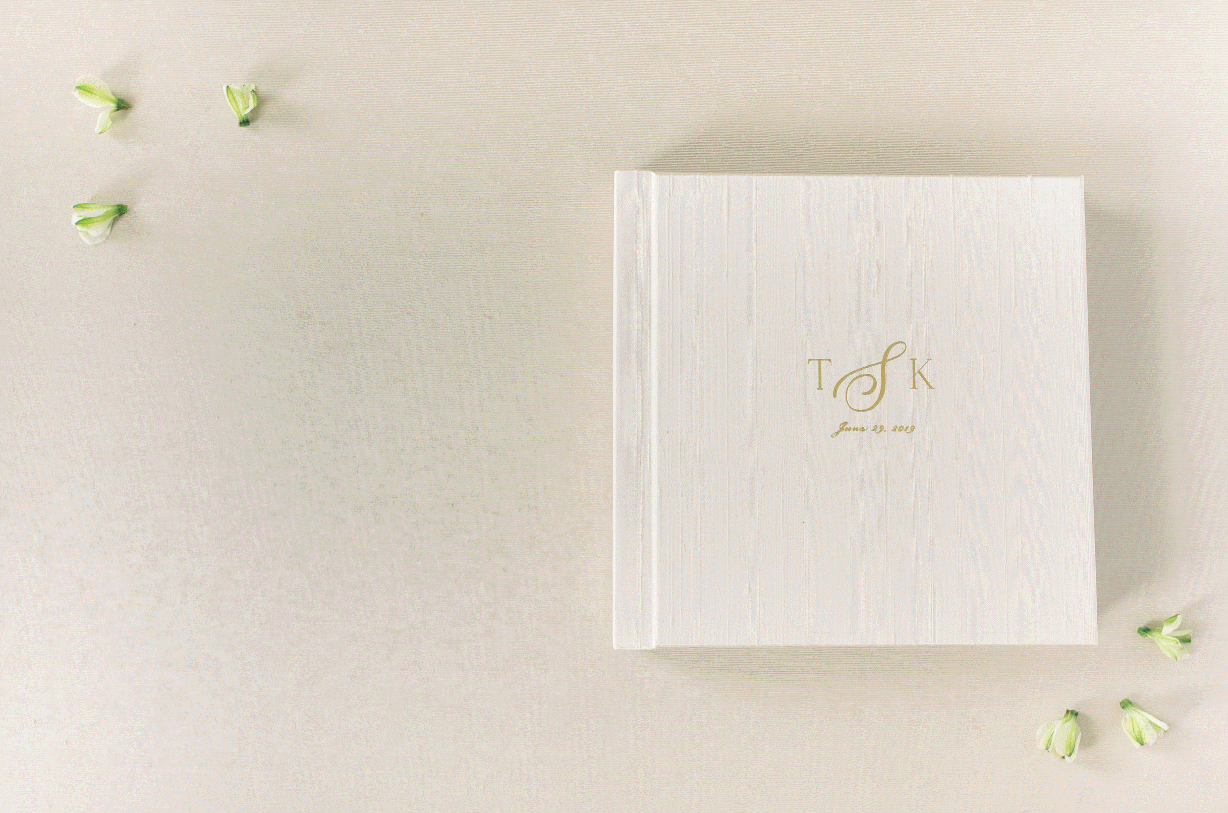 A stunning cream silk heirloom album featuring images from a Meridian House wedding in Washington, DC; complete with a custom foil monogram embossing.