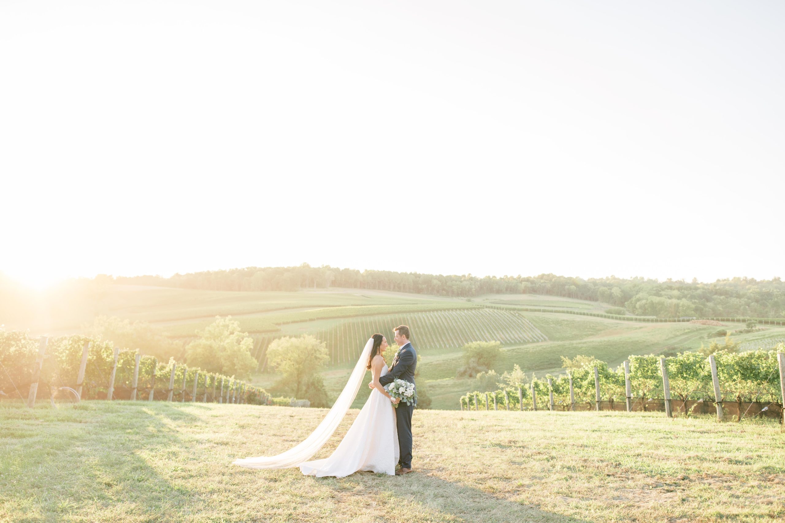 A beautiful outdoor ceremony and reception among the vines at Stone Tower Winery in Leesburg, Virignia, outside of Washington, DC.