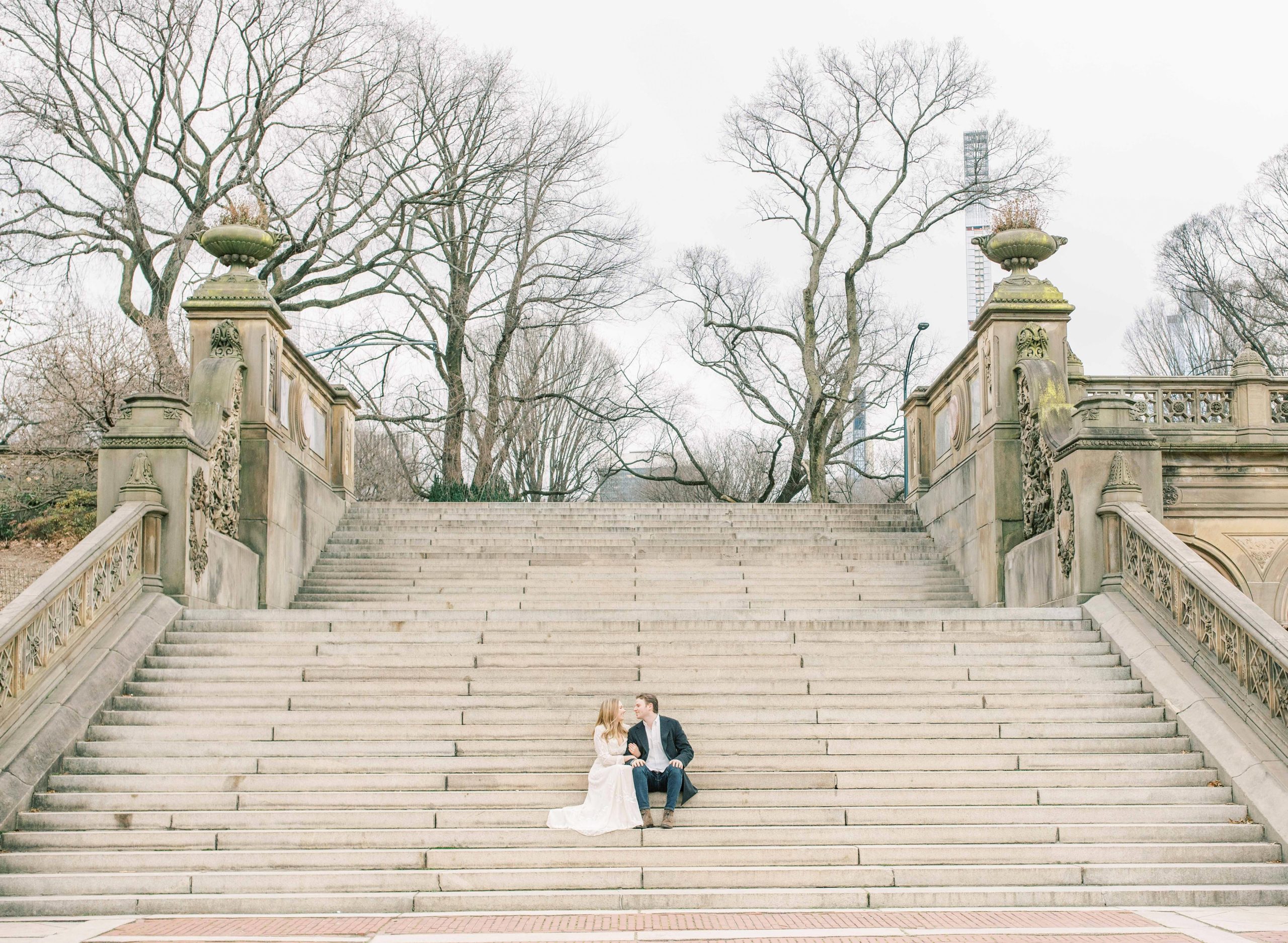 A beautiful Central Park Engagement Session in New York City at Bethesda Terrace and the iconic Bow Bridge.