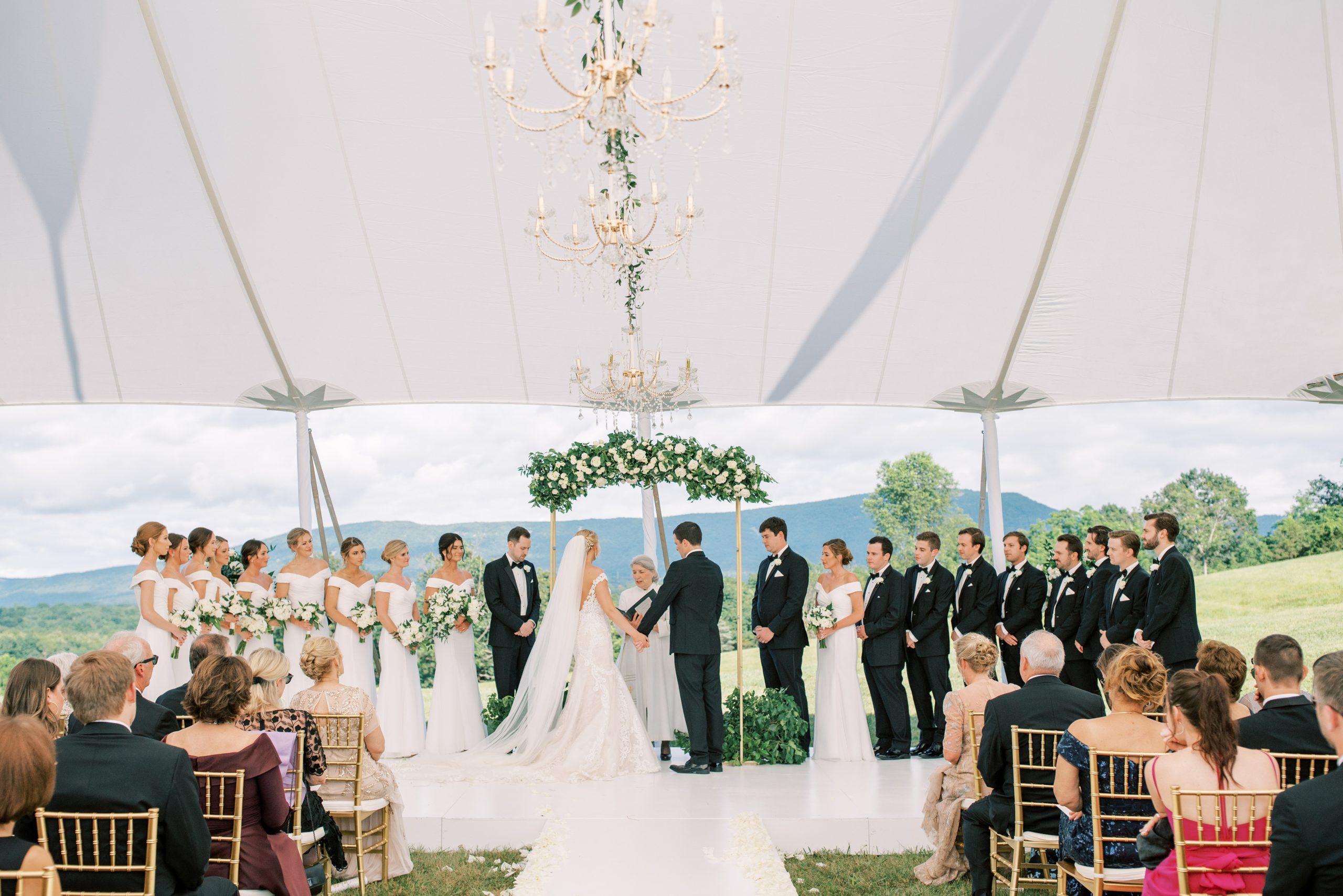 View this elegant, sailcloth-tented wedding at a private estate on the foothills of the Blue Ridge Mountains in Virginia.