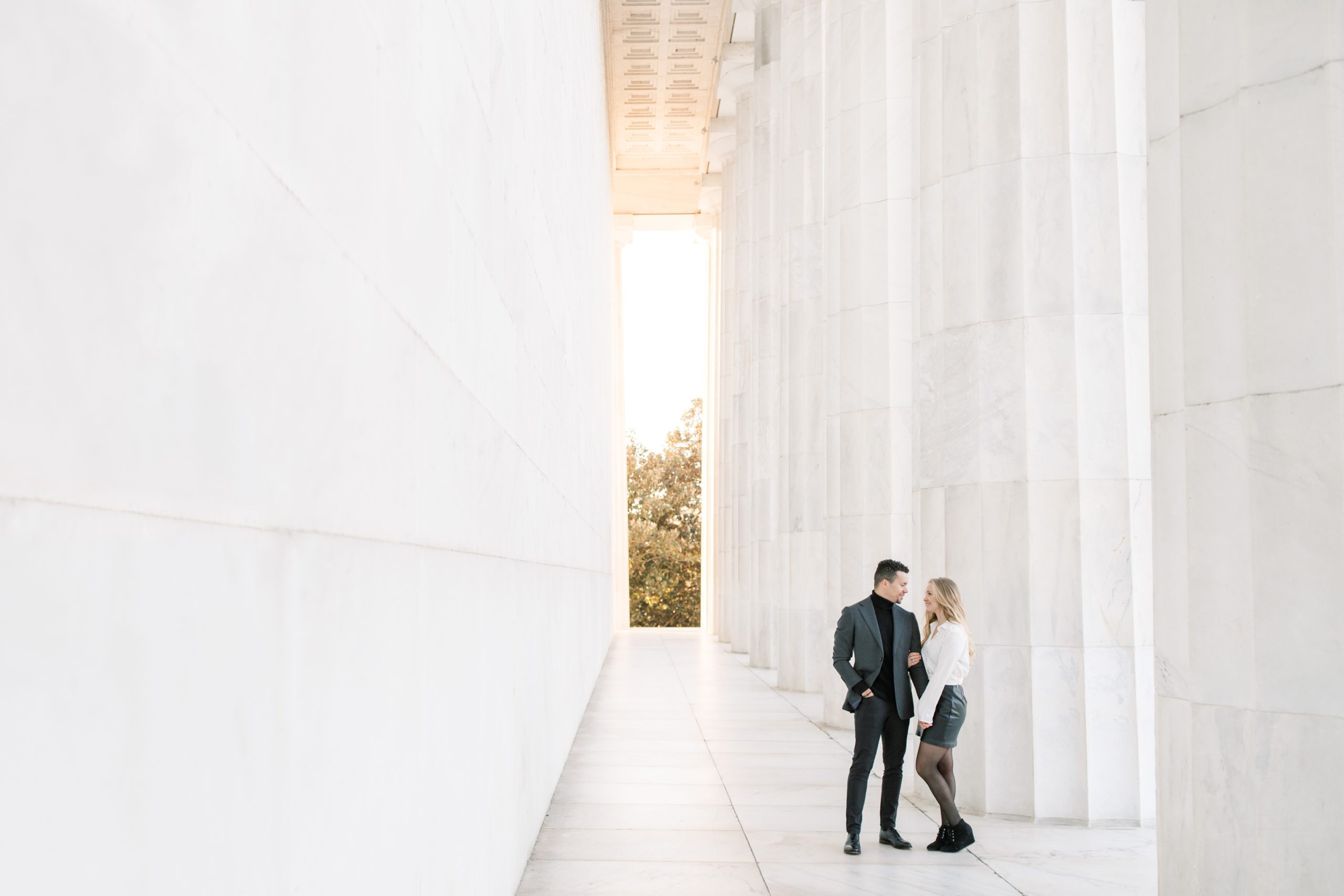 A winter engagement session in Washington, DC at the National Mall featuring iconic sites such as the Lincoln Memorial and Reflecting Pool.