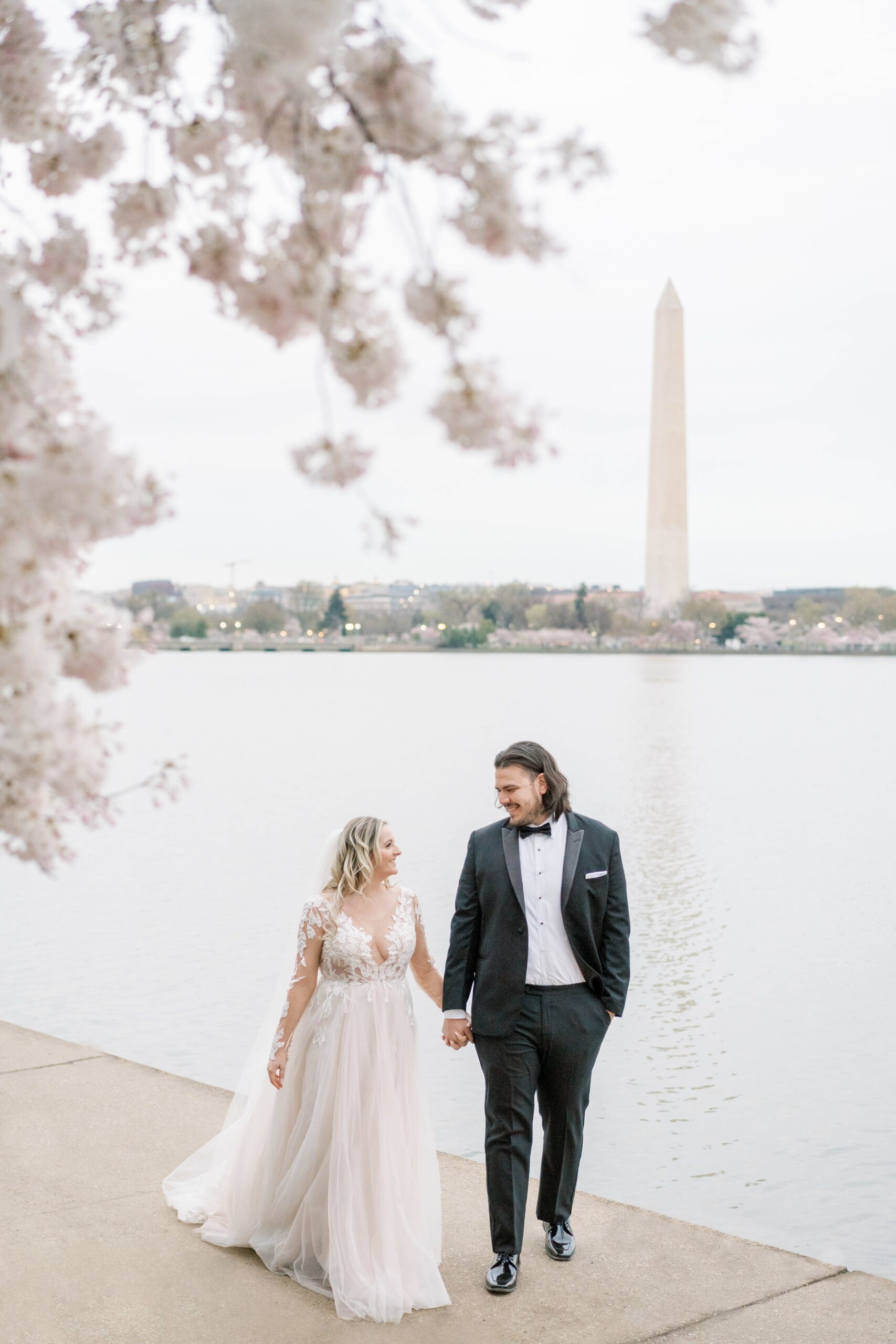 A romantic sunrise portrait session during the peak Cherry Blossom bloom at the Tidal Basin in Washington, DC.