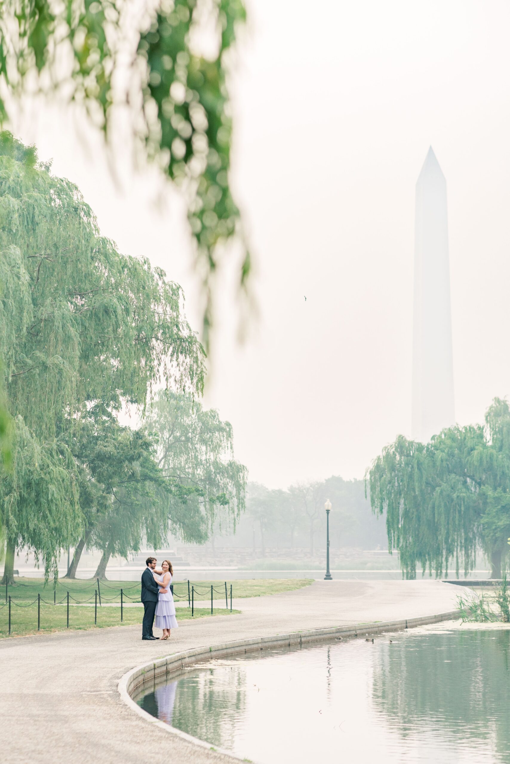 Hazy Washington Monument engagement photos in Washington, DC.