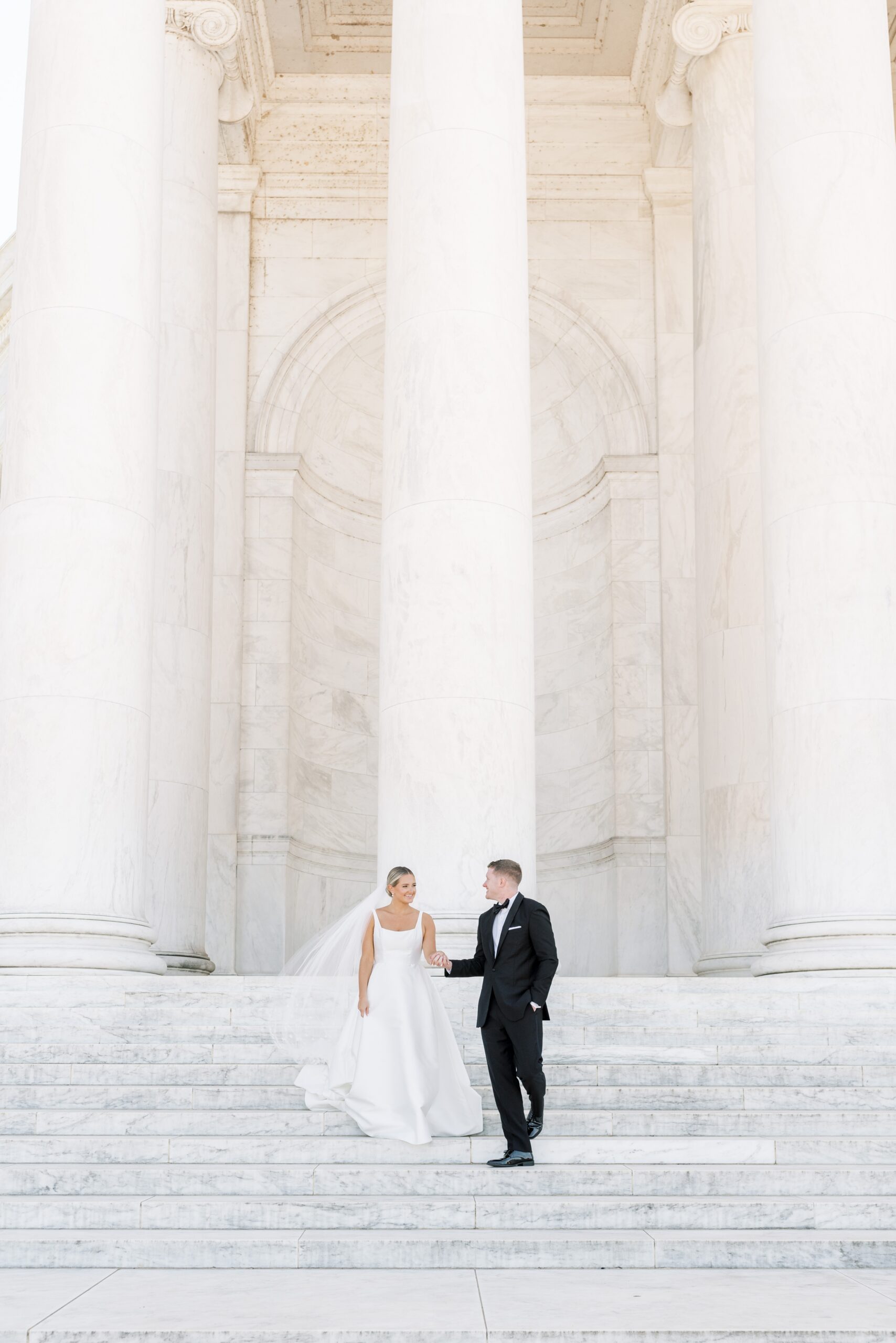 A chic black tie wedding at the downtown Conrad Hotel in Washington, DC. Portraits were captured at the iconic Jefferson Memorial. 