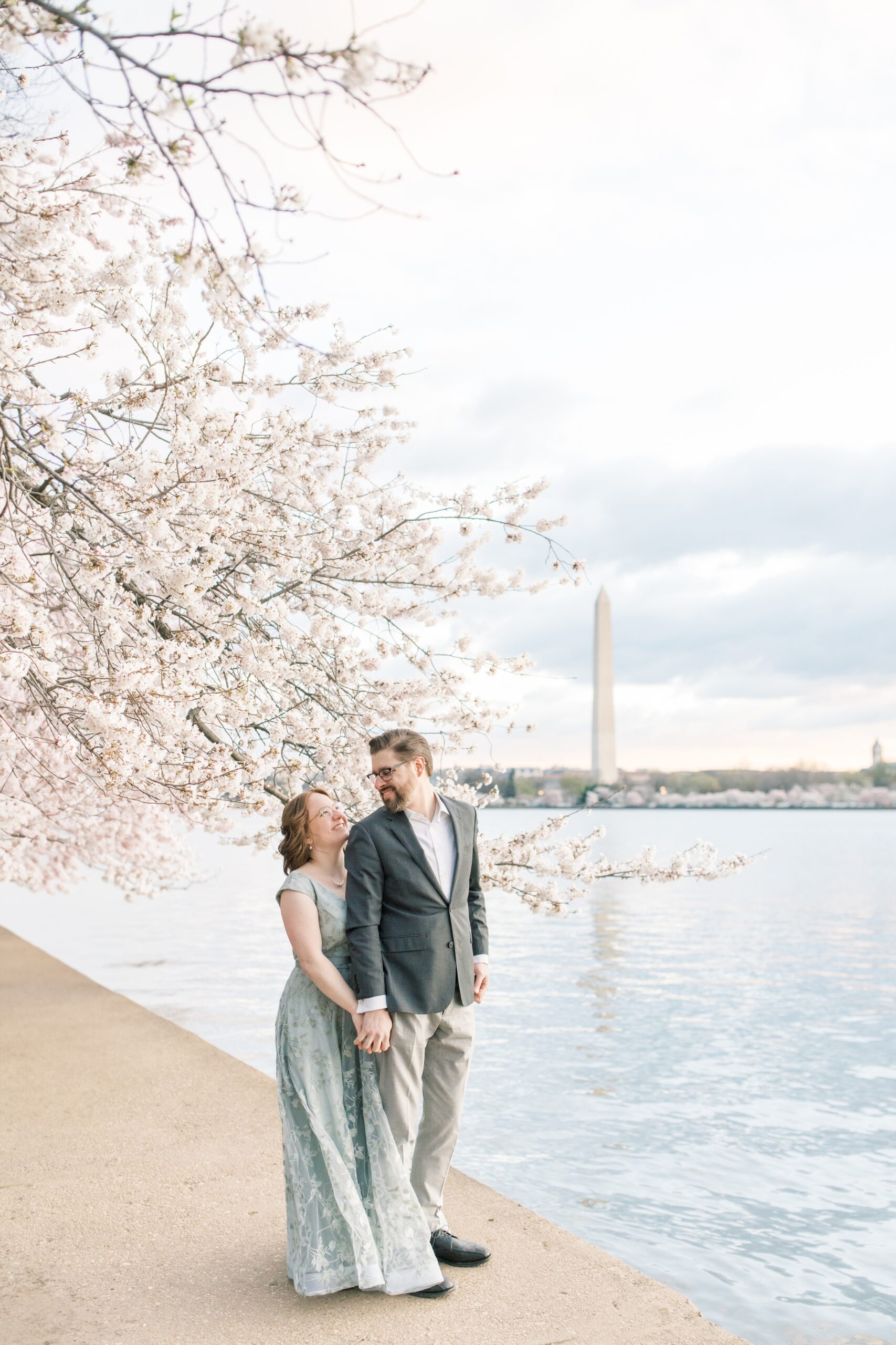A stunning cherry blossom anniversary session at the Tidal Basin in Washington, DC during peak bloom.