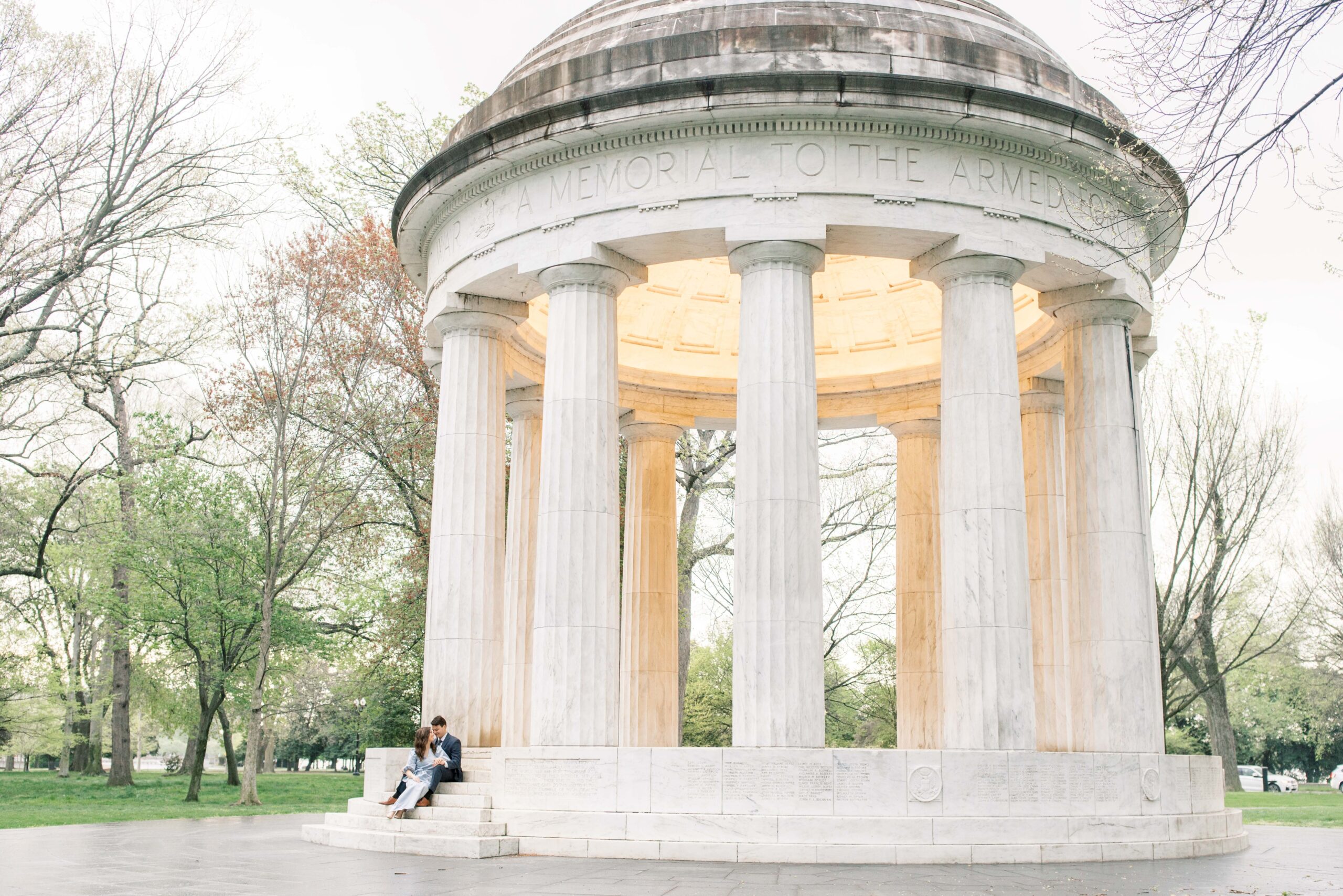 A romantic overcast engagement session at the Reflecting Pool & DC War Memorial on the National Mall in Washington, DC.
