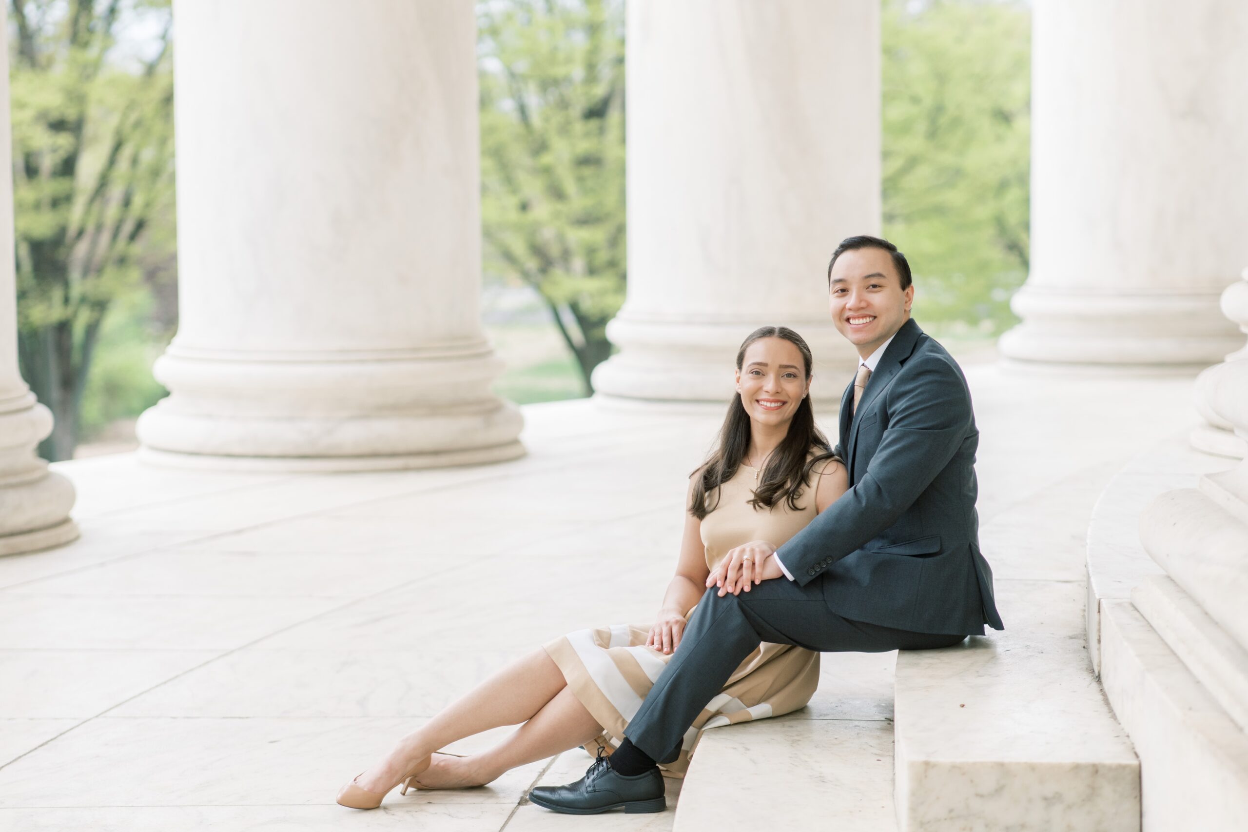 A sunrise engagement session during cherry blossom peak bloom in Washington, DC with photos at the Tidal Basin and Jefferson Memorial.