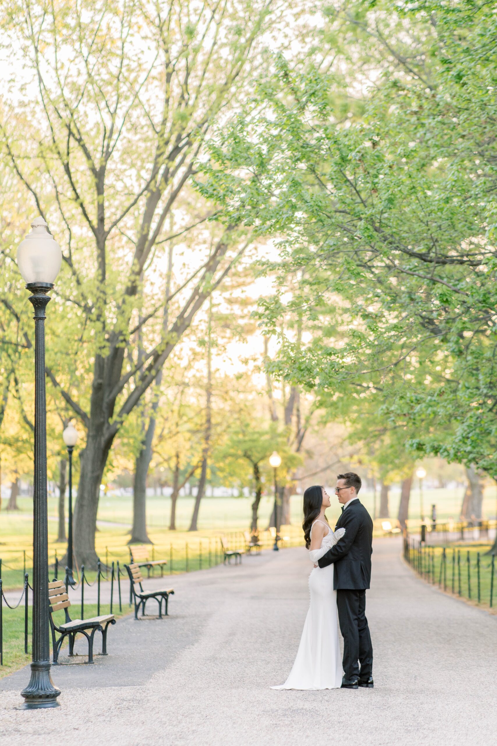 A beautiful sunrise elopement at the Reflecting Pool, Constitution Gardens, and DC War Memorial in Washington, DC.