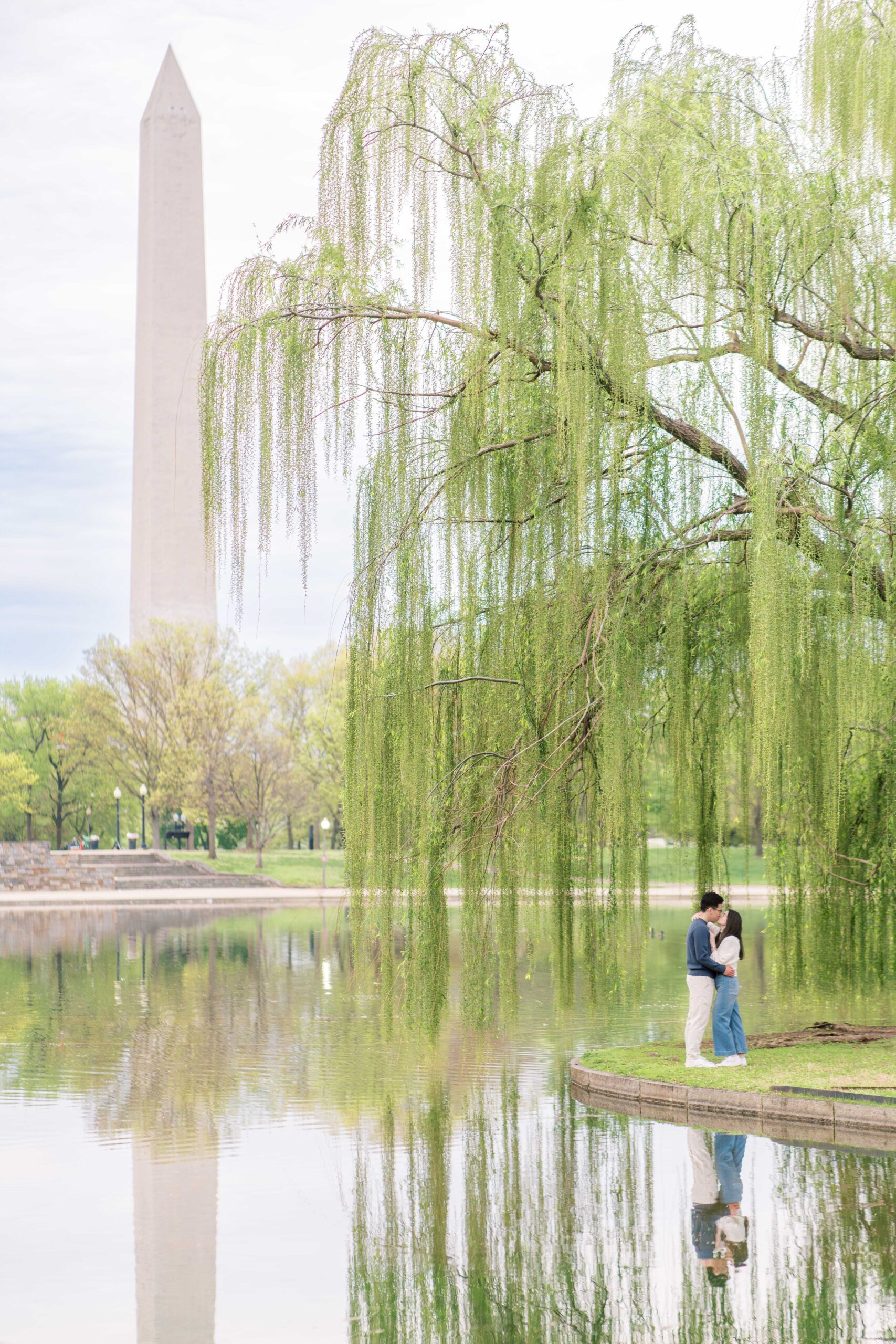 A sunrise engagement session at the National Mall in Washington, DC, featuring portraits at the Jefferson Memorial and Reflecting Pool.