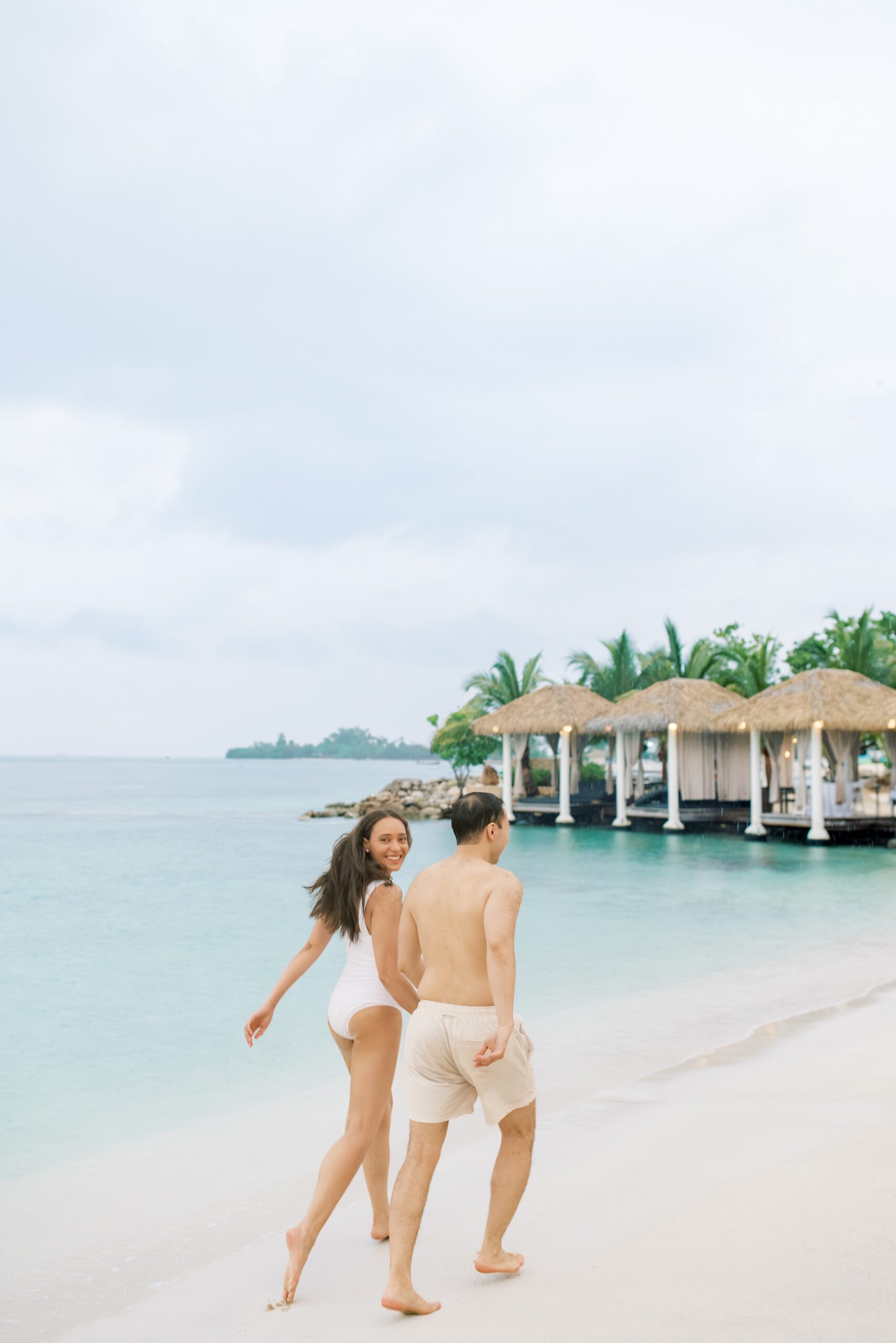 A beach front Caribbean engagement session held at Sandals Resort in Negril, Jamaica.