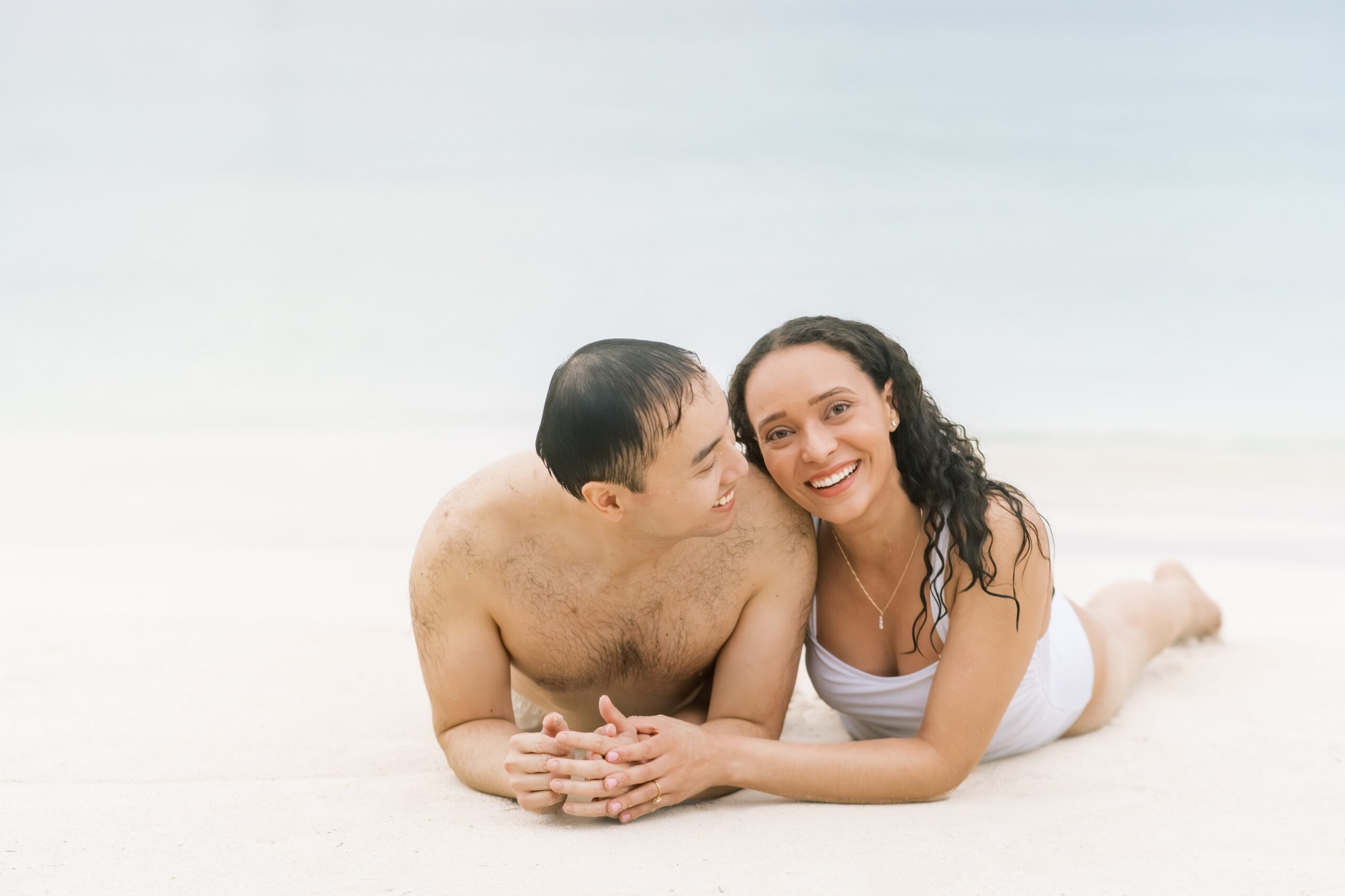 A beach front Caribbean engagement session held at Sandals Resort in Negril, Jamaica.
