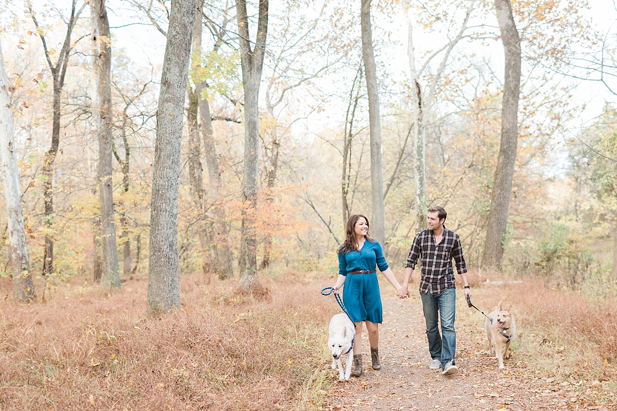 The vivid colors of fall popped during this romantic engagement session at Manassas Battlefield Park in VA with one sweet couple and two adorable dogs!