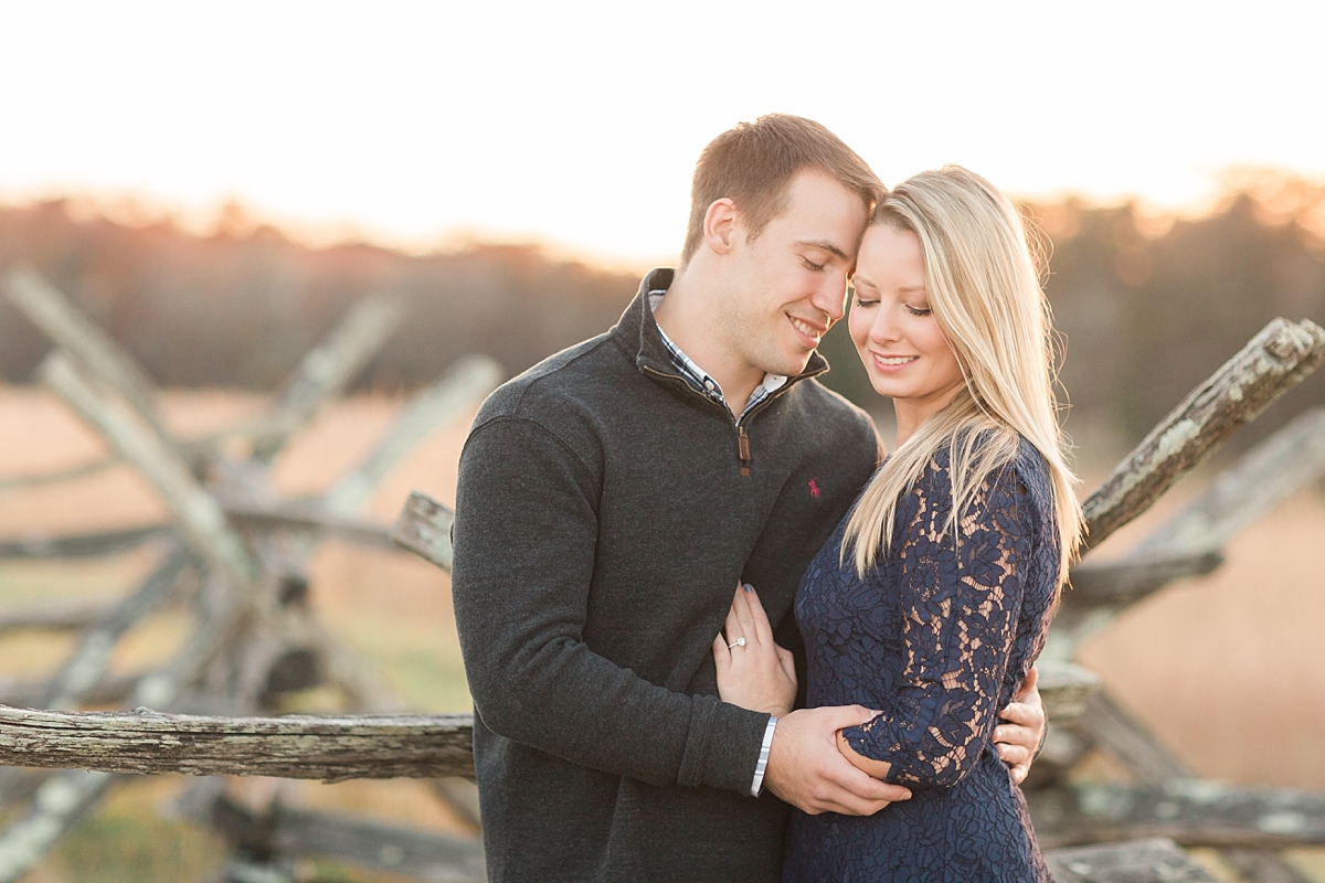 A romantic engagement session at the Manassas Battlefields and the Henry Hill House featuring views of sweeping fields and colorful fall foliage.