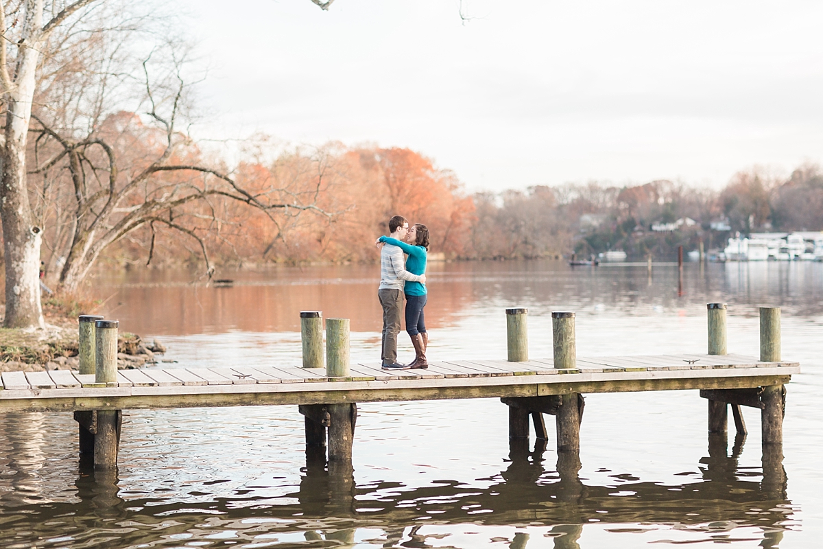 A romantic fall engagement photography session in Occoquan Regional Park, VA with a sunset over the gorgeous waterfront.