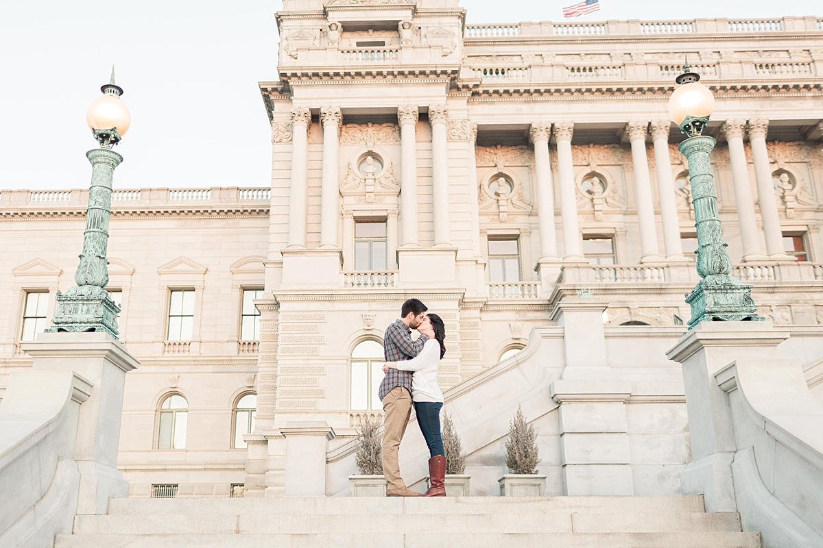 A Washington, DC wedding photographer heads downtown to the classic Library of Congress and DC War Memorial for a winter engagement session filled with sun.