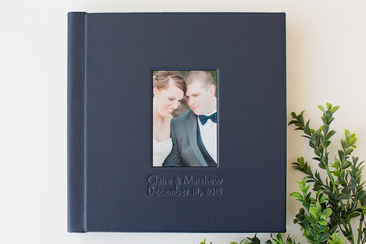 A luxurious Legacy Wedding Album in navy top grain leather from a wintry December wedding in Chapel Hill, NC on the campus of UNC.