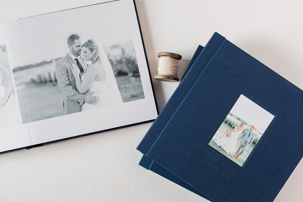 A gorgeous navy linen wedding album of images photographed by Washington, DC photographer Alicia Lacey at Stone Tower Winery in Leesburg, VA.
