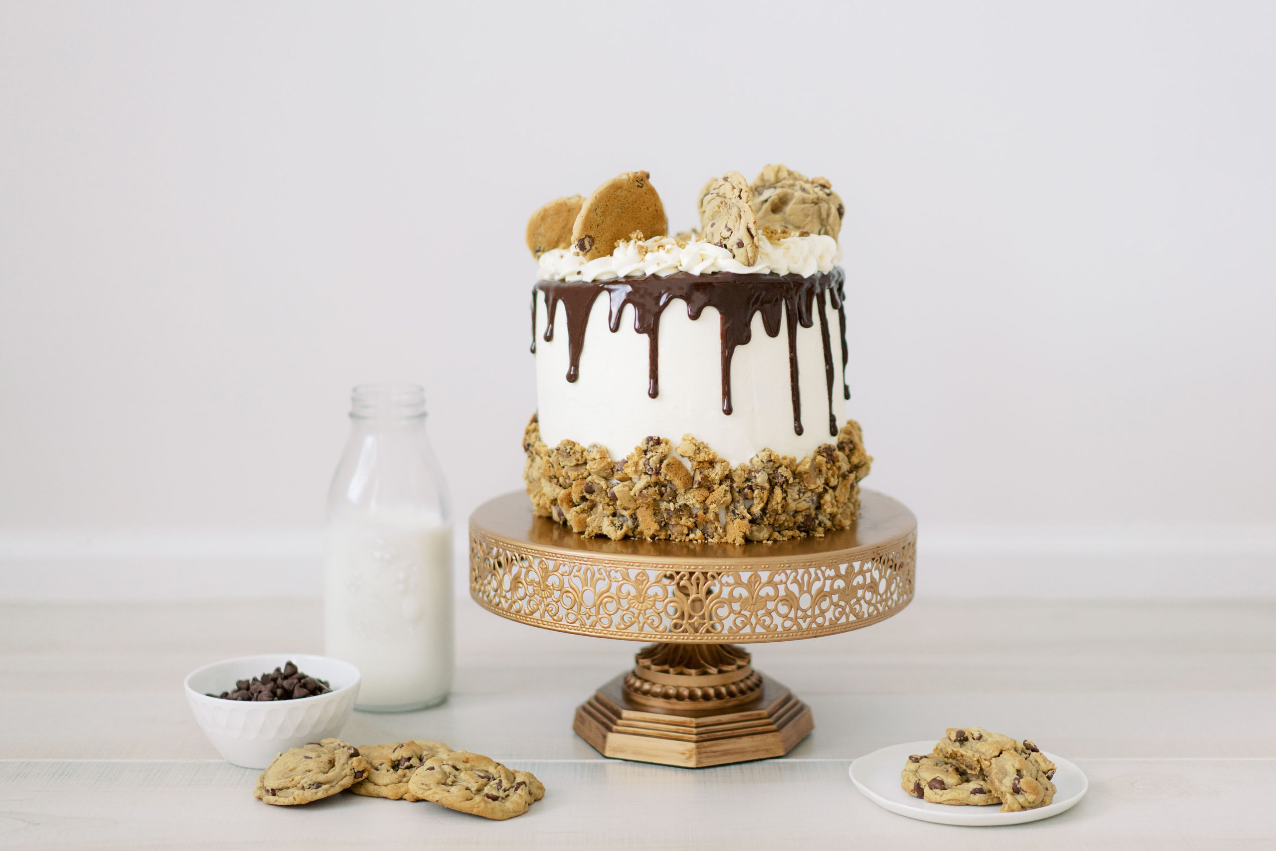 An incredible 3-layer Chocolate Chip Cookie Cake, featuring homemade cookies, a delicious vanilla buttercream, and chocolate chip cake!