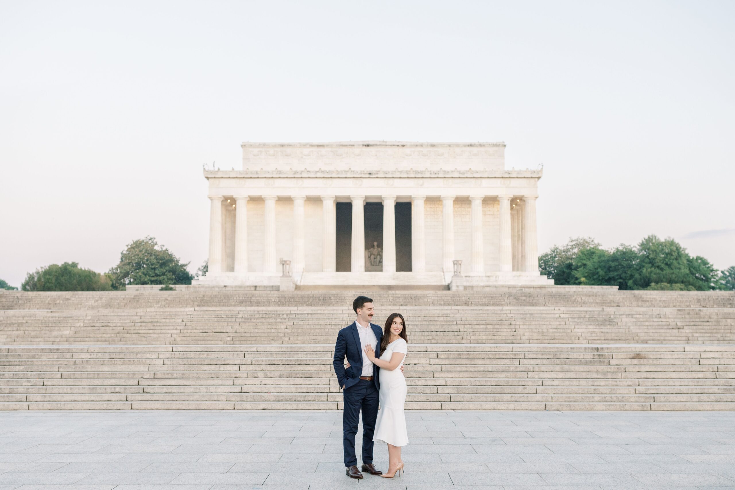 A summery engagement session at the iconic Monuments in Washington, DC including the Lincoln Memorial and Reflecting Pool.